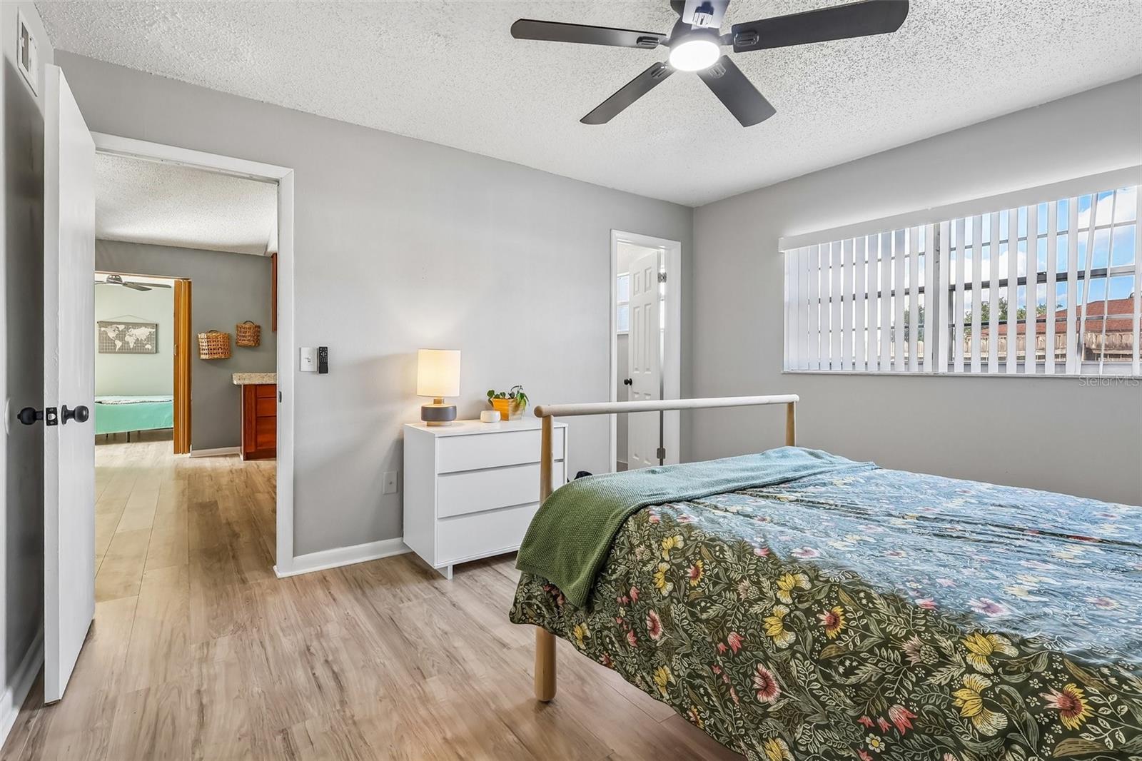 The primary suite has a large window and an en-suite bathroom