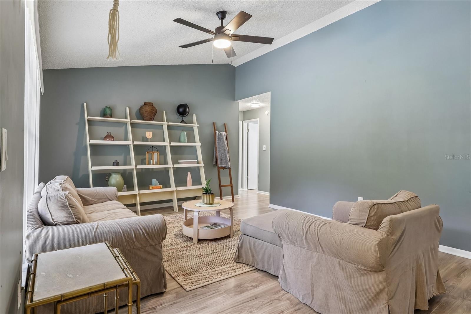 There is a nice wood-looking vinyl flooring throughout the entire house for a modern, fresh feel