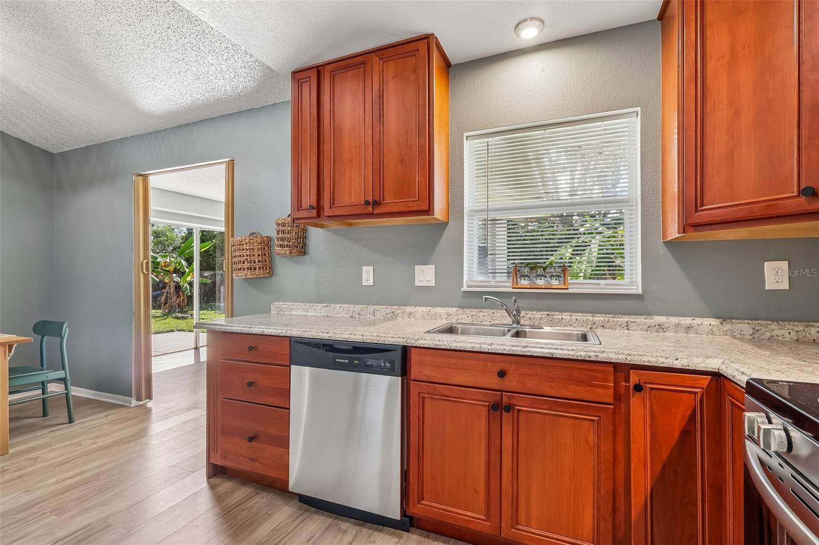 Everyone loves a window in the kitchen especially over the sink! The doorway tot he bonus room is to the left of the kitchen. This is also the access to the backyard.