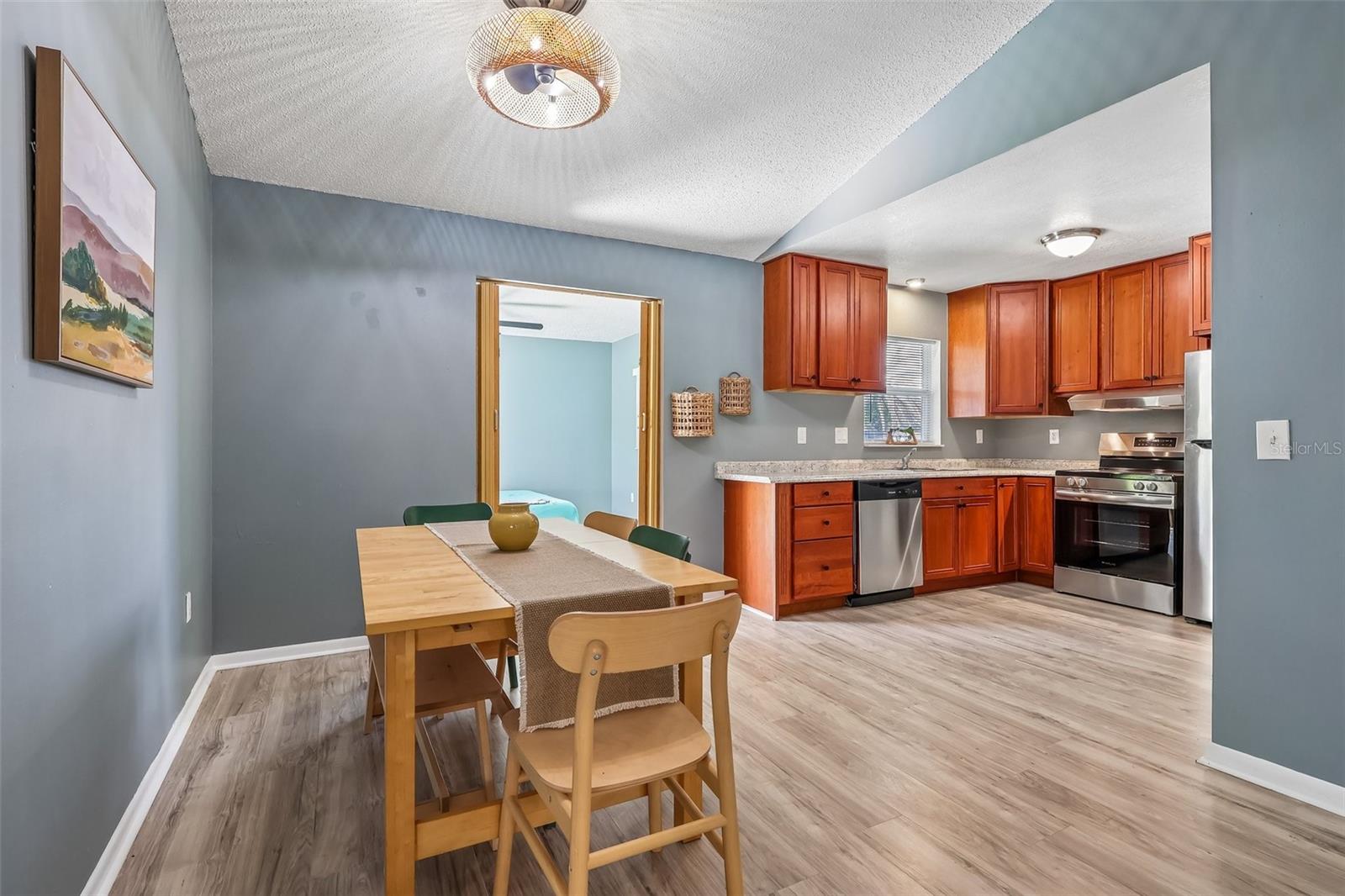 The dining room opens up to the kitchen for enjoying meals with friends and family and easy hosting