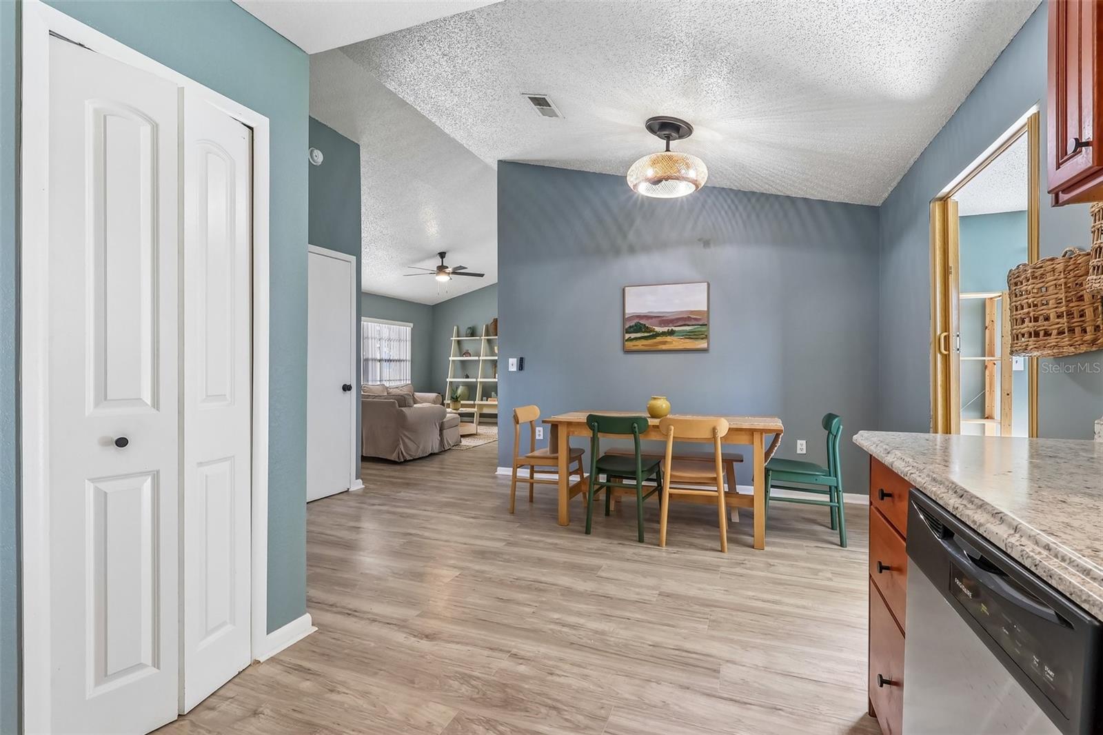 View from the kitchen to the dining room and you have an updated modern light fixture