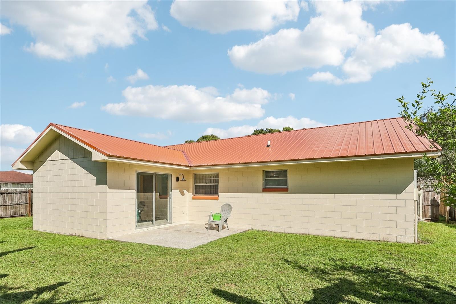 Check out your BRAND NEW METAL ROOF and a porch ready for grilling and lounging
