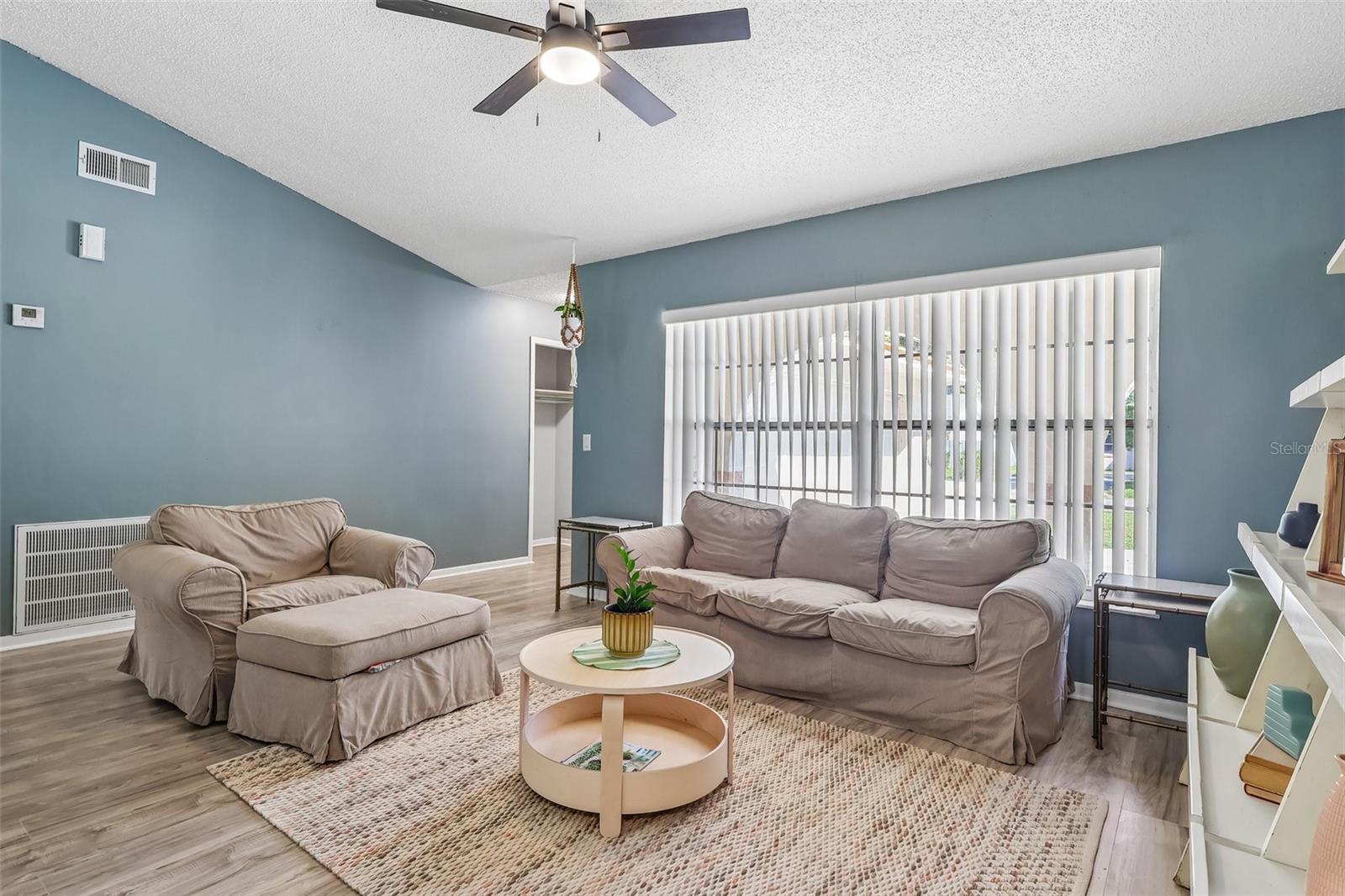 The vaulted ceiling in the living room helps it feel spacious and airy