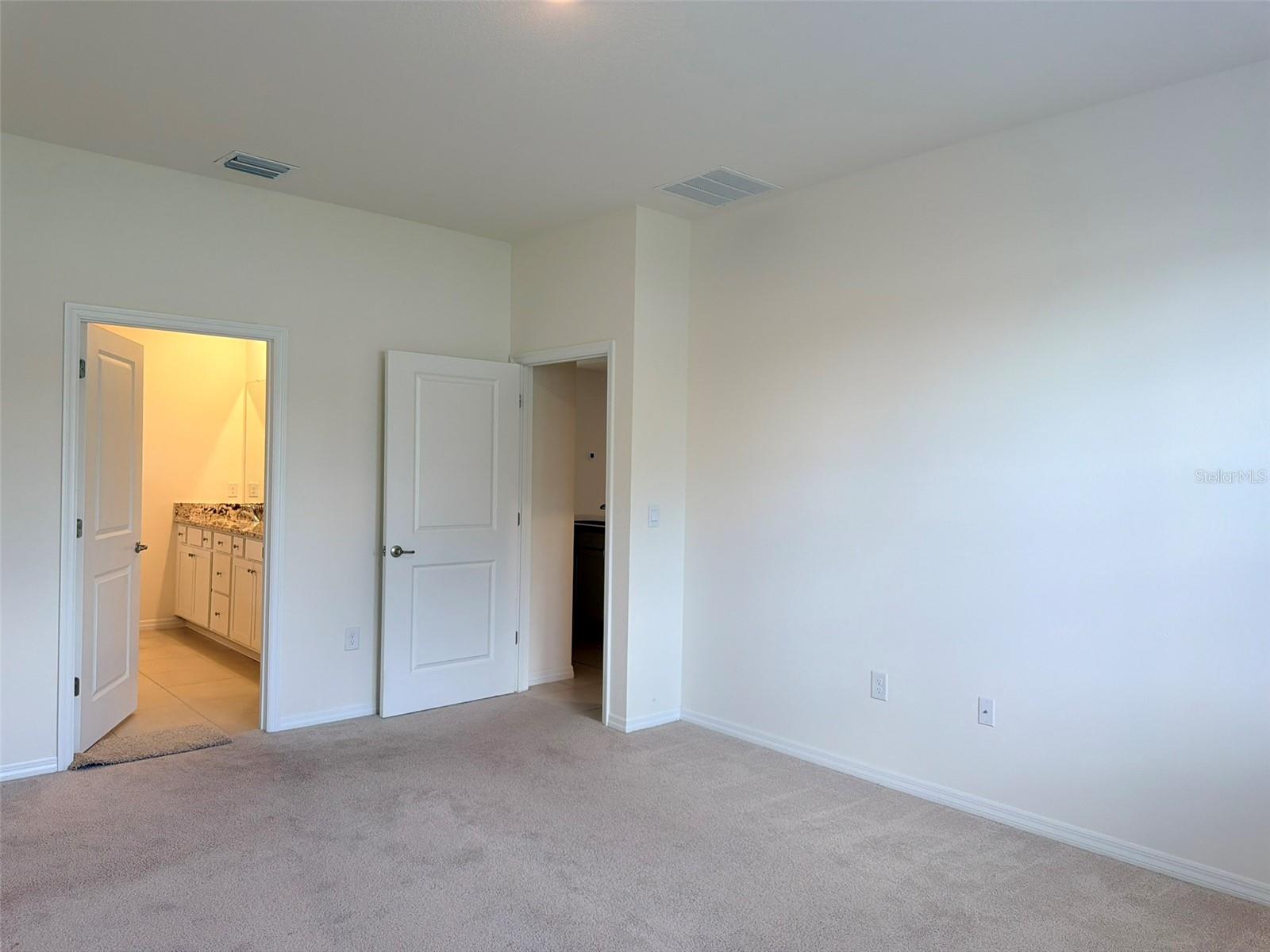 Very spacious and bright primary bedroom with luxury master bath.