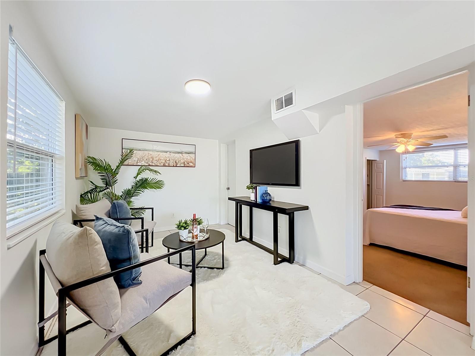 Family Room with door to Primary Bedroom
