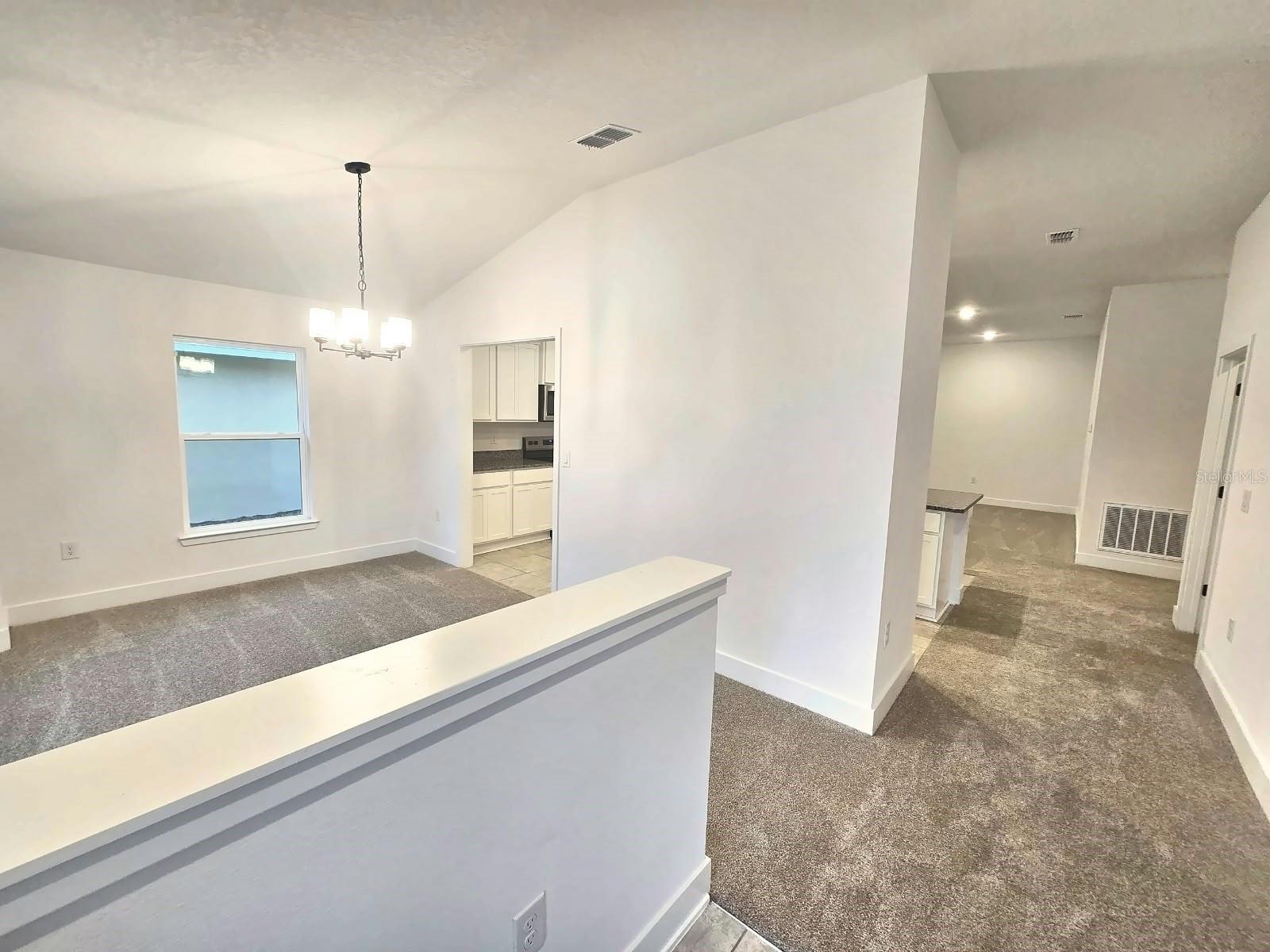 Foyer view to dining room and hall