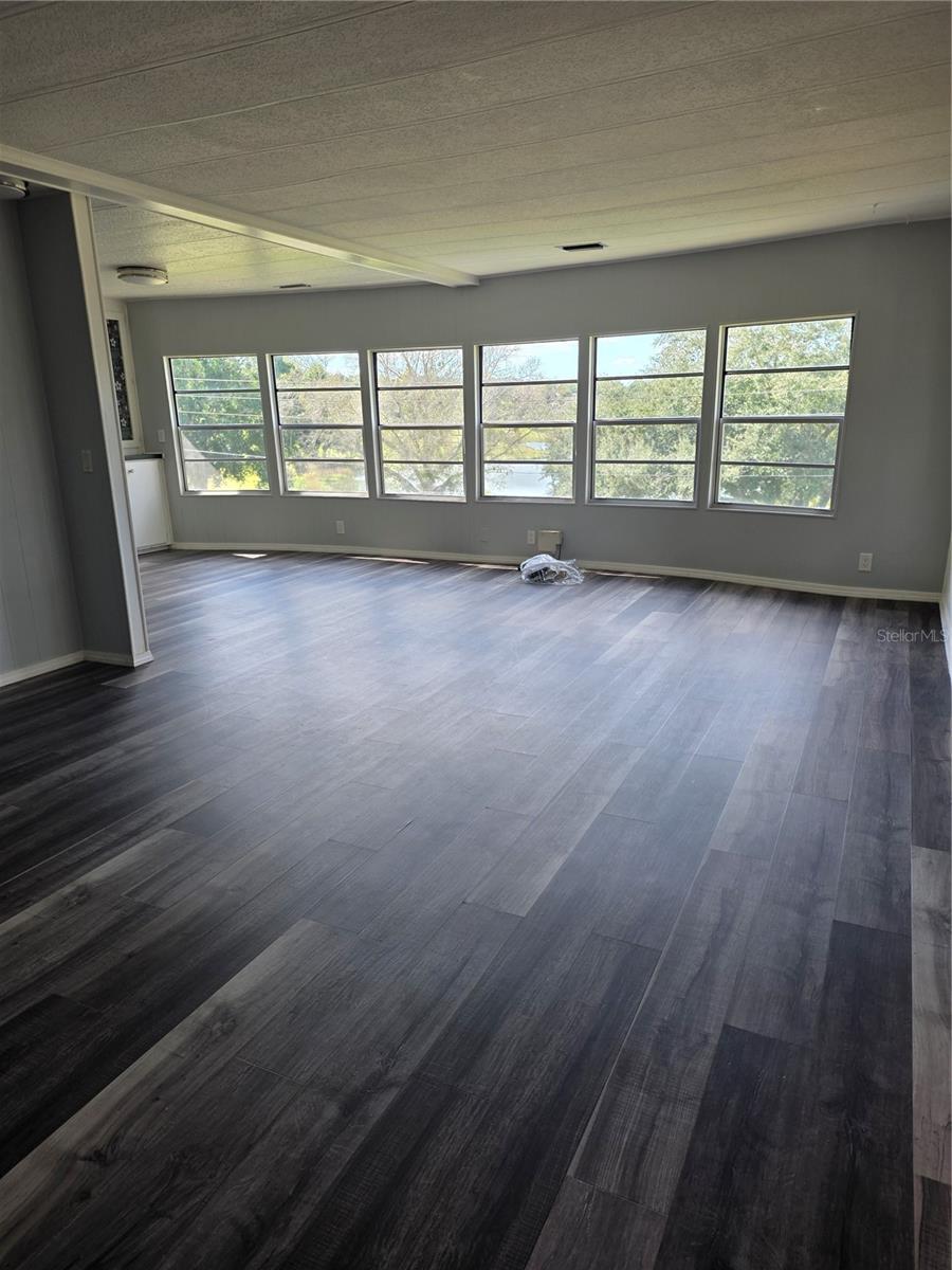 6 BAY WINDOWS IN LIVING ROOM