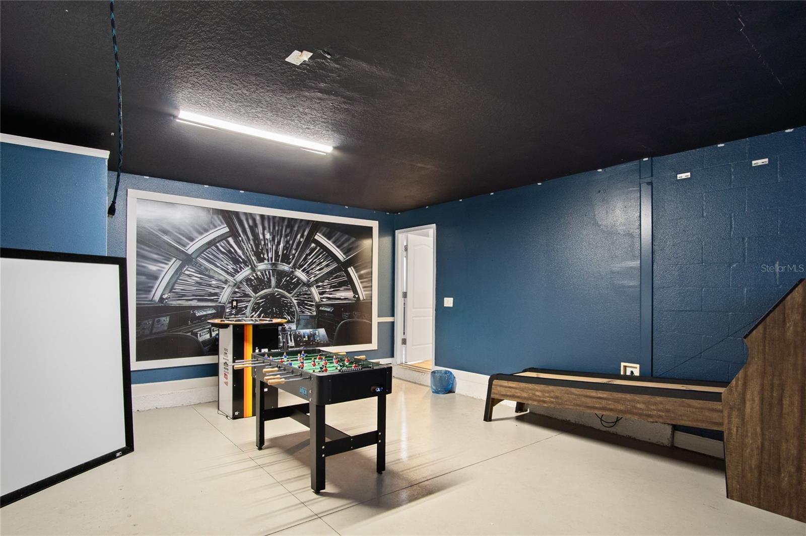 Down time from the community pool or theme parks can be in the personal game room in the converted garage.