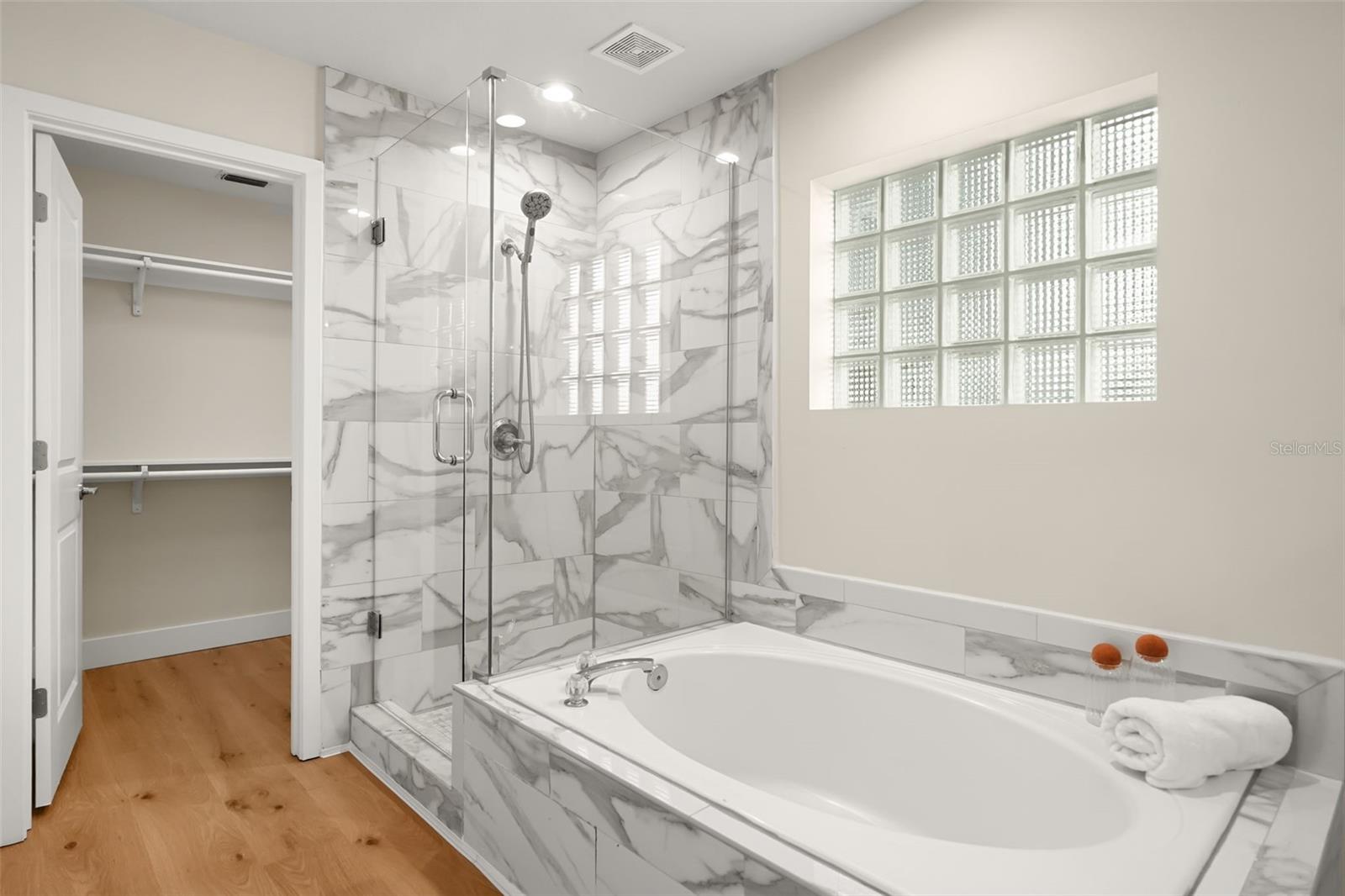 Downstairs Primary Bathroom and walk in closet