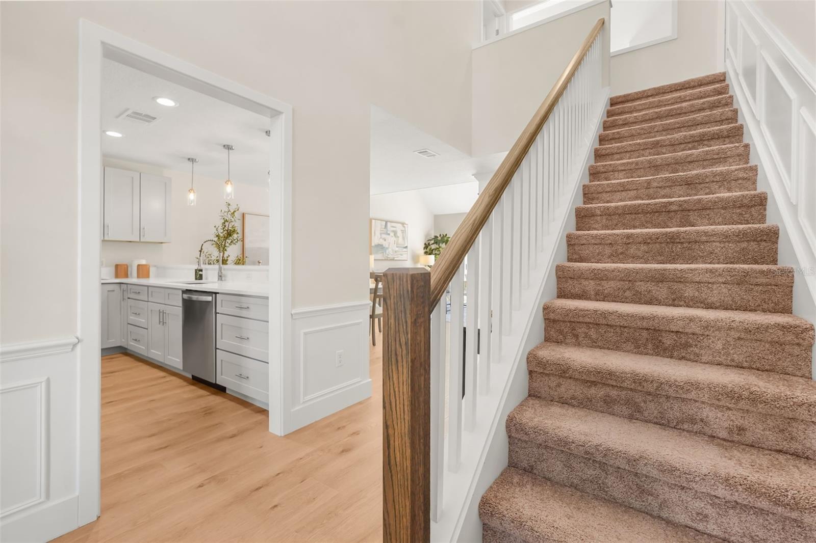 Stairs leading to 2 guest bedrooms and a guest bathroom