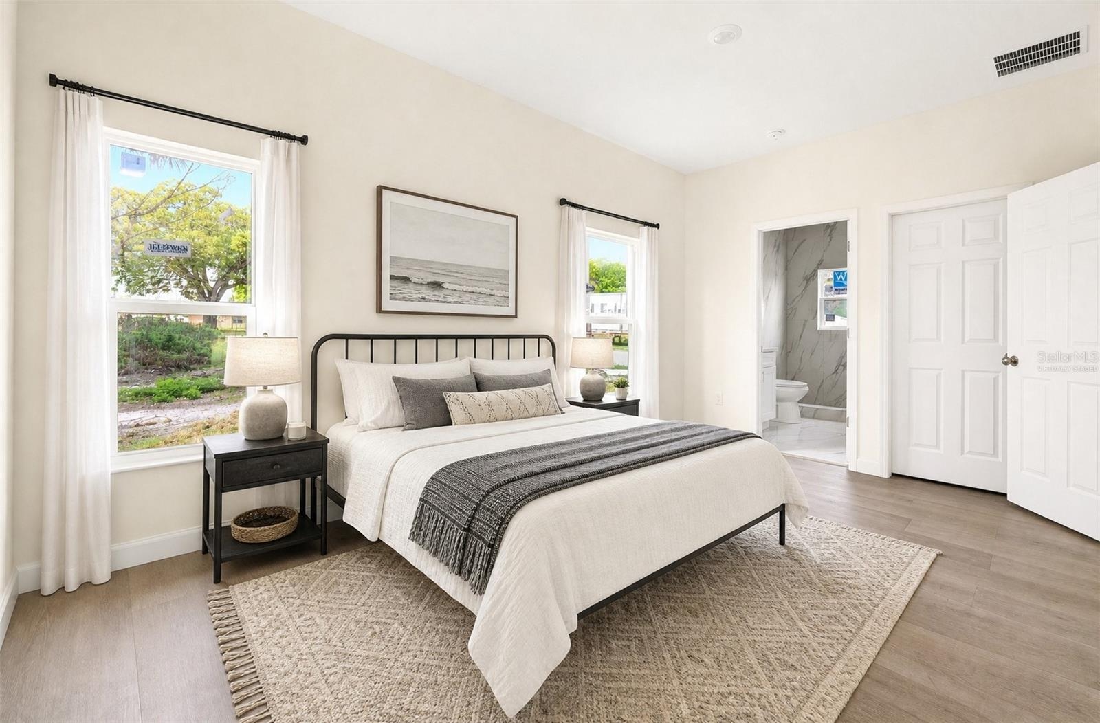 Light filled primary suite. Virtually Staged.