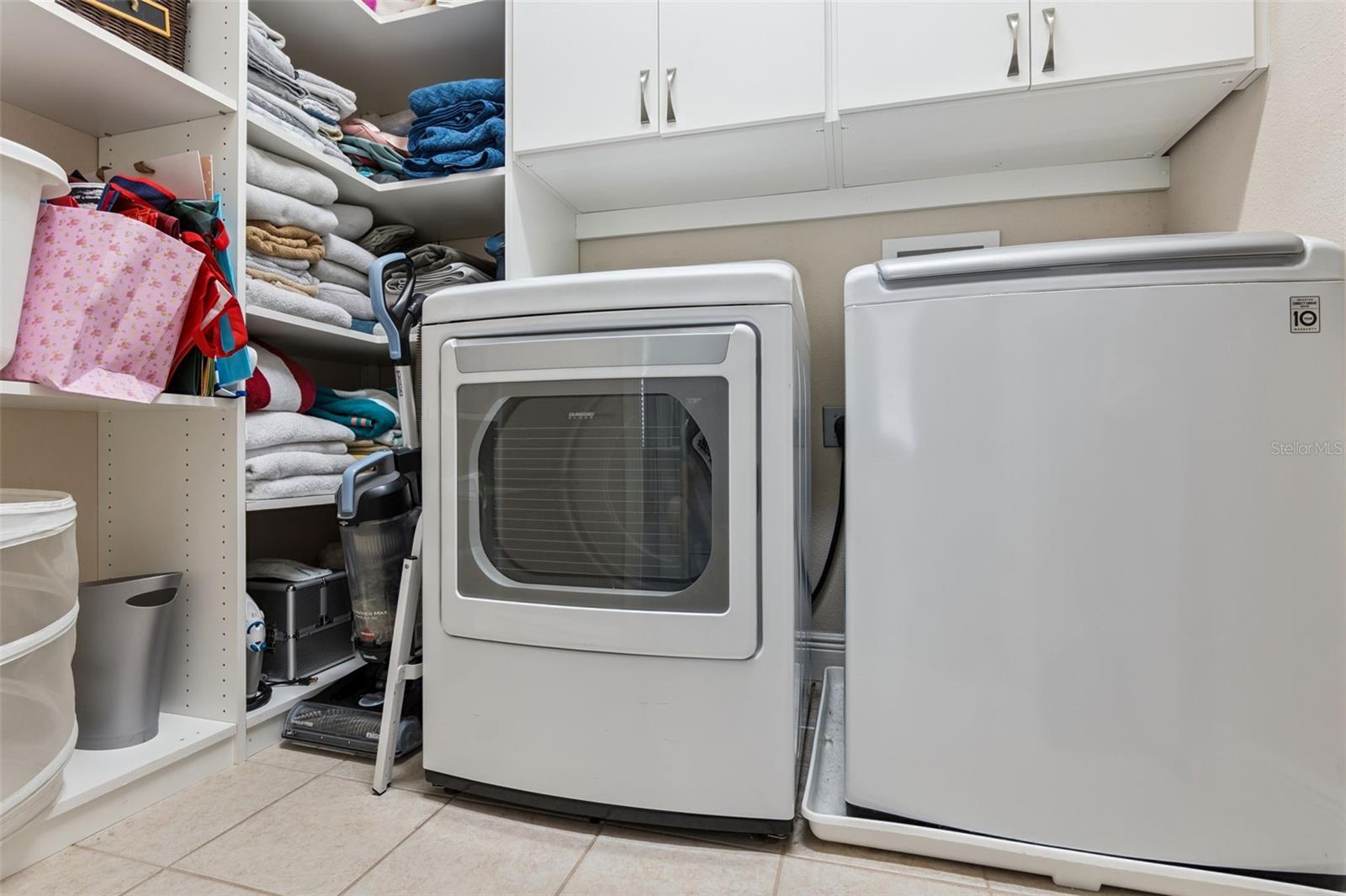 Third floor laundry room with added storage