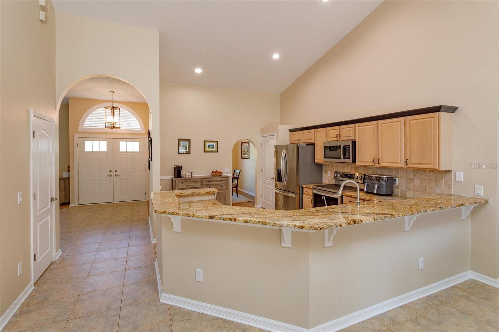 Expansive granite counters with backsplash