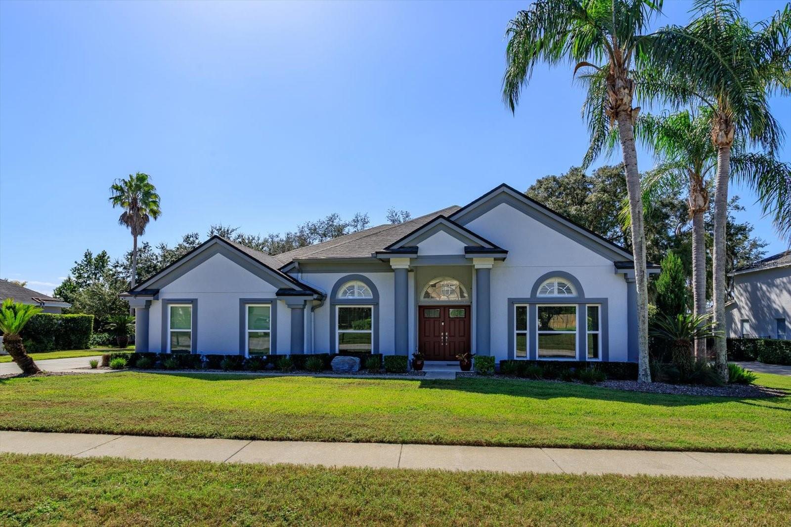 4 Bedroom 3.75 Bathroom with upgraded screen enclosed pool overlooking spacious fenced yard and pond view.