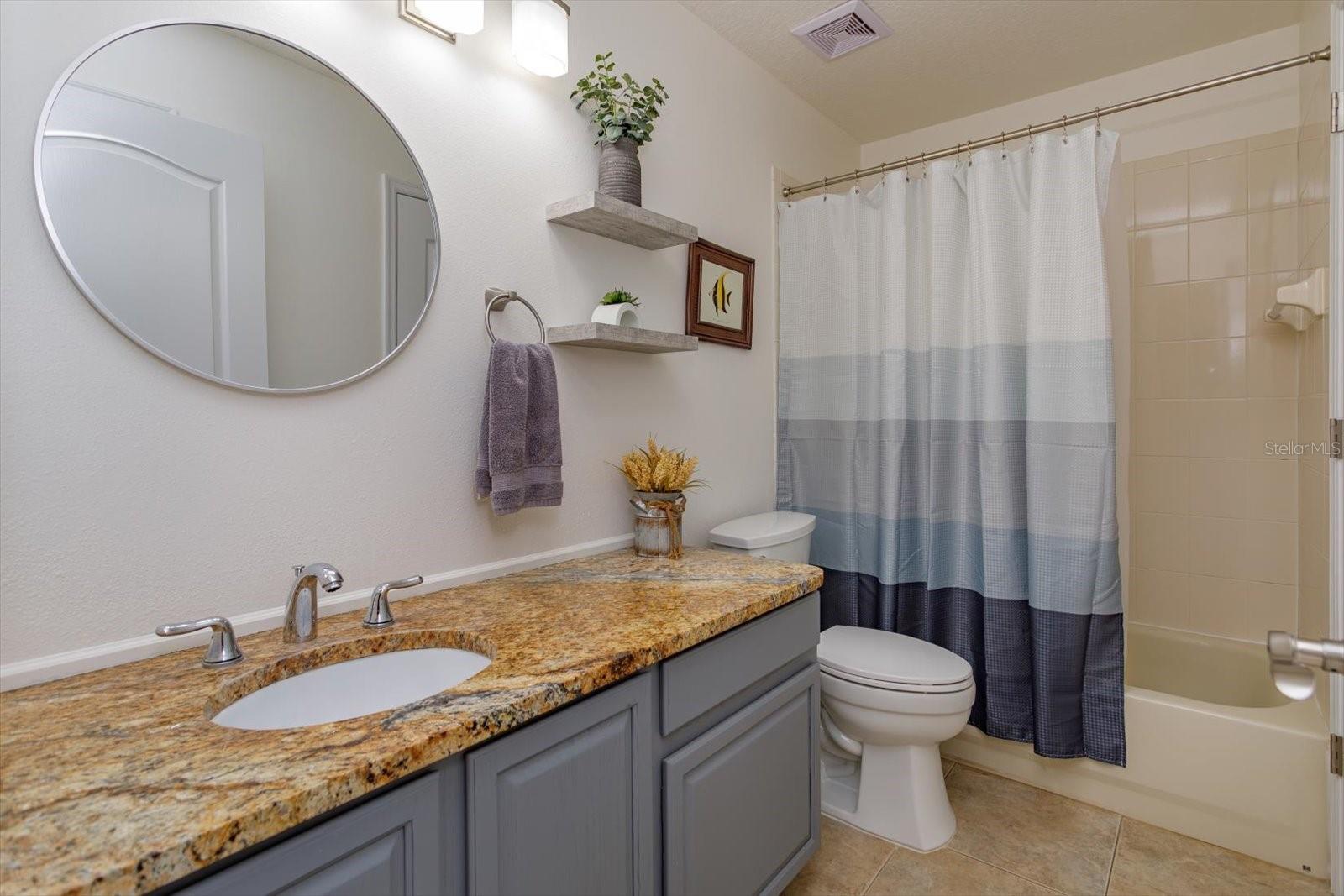 Updated guest bathroom with granite counters