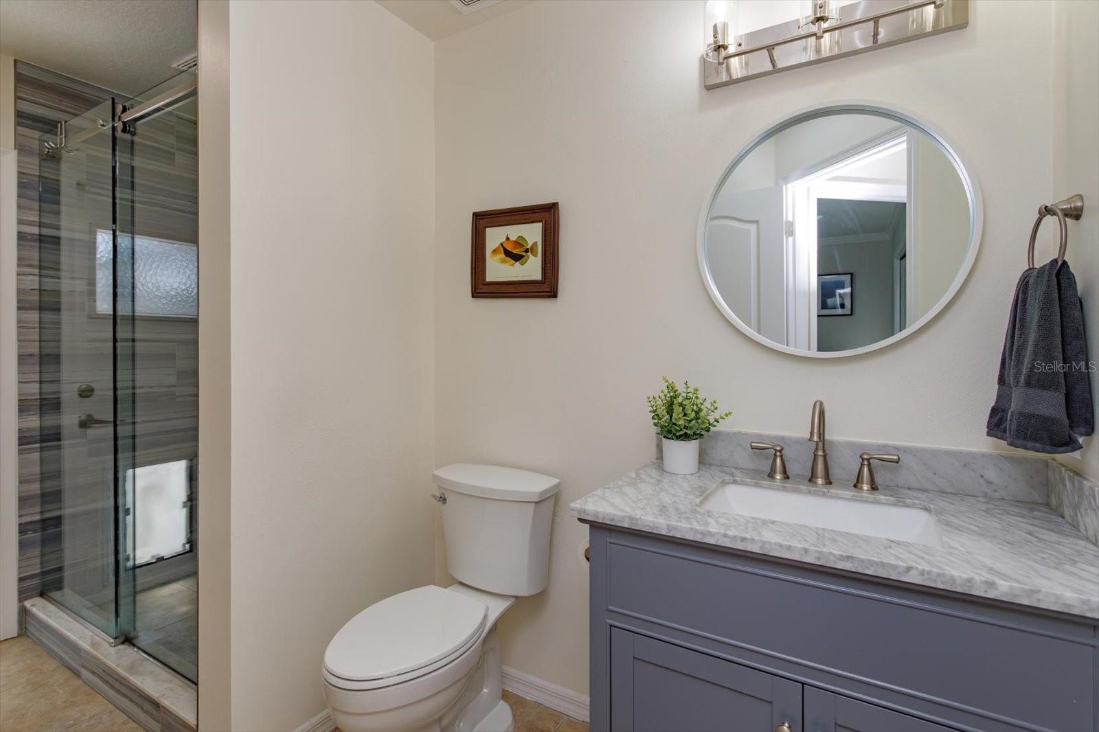 Renovated pool bathroom with walk in shower