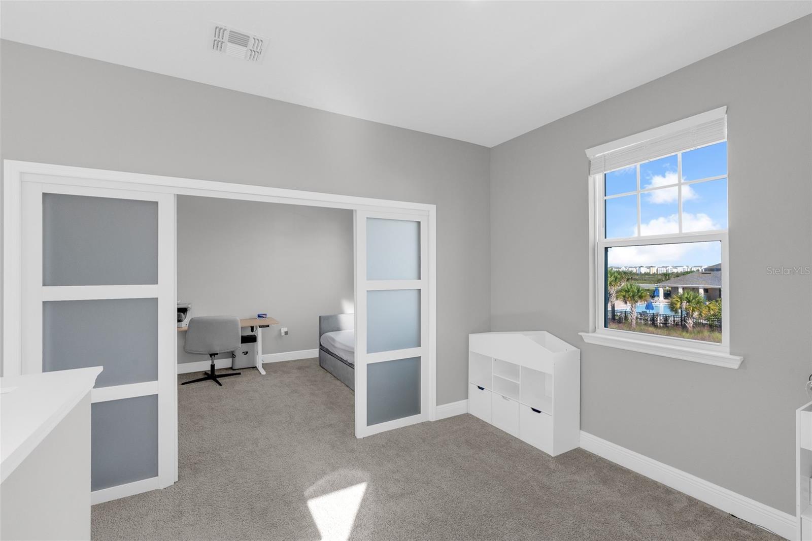Versatile upstairs loft with sliding doors