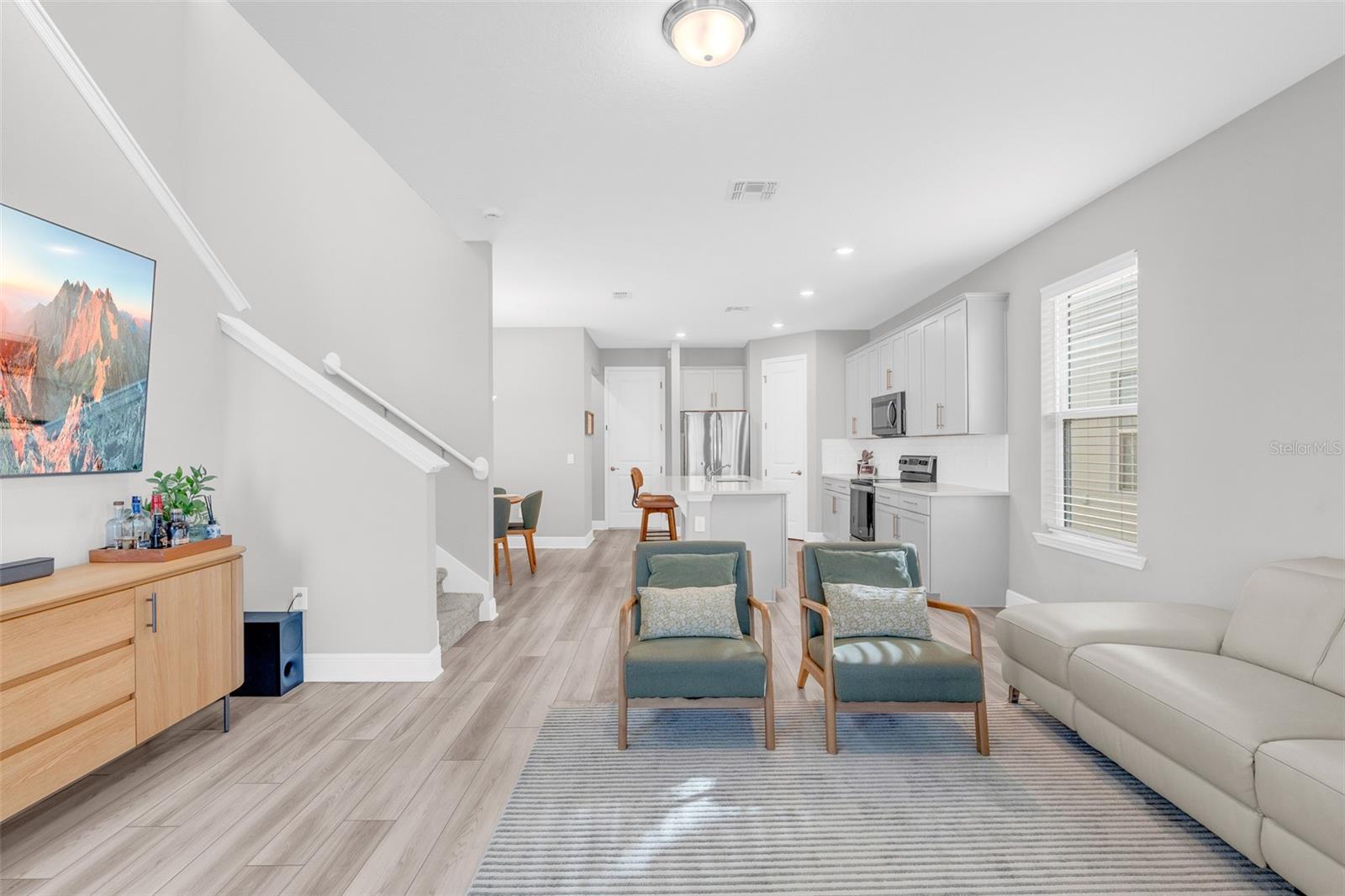 Spacious living room connected to the kitchen and dining area