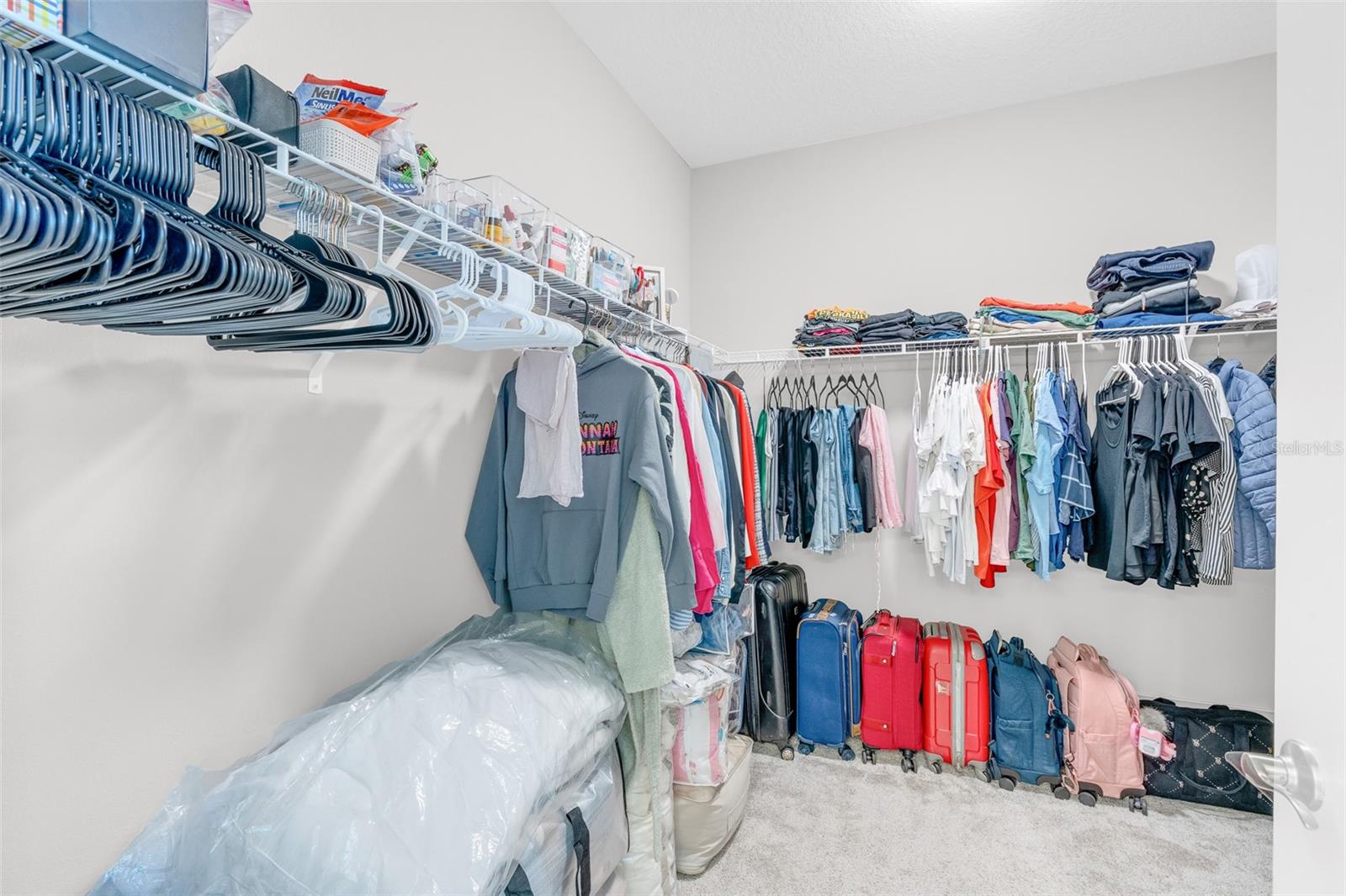 Walk-in closet 1 with hanging space and shelving