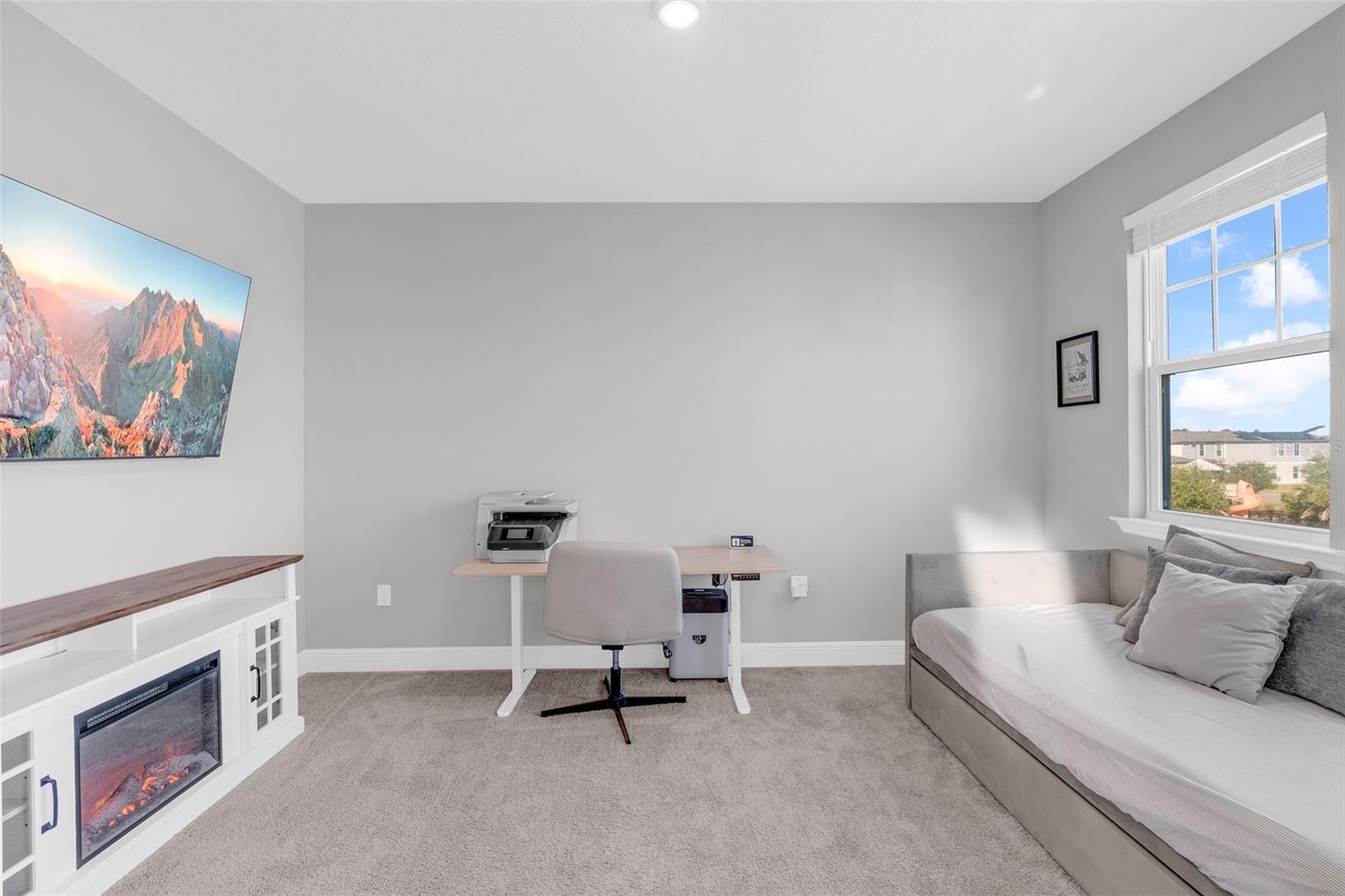 Upstairs flex room with natural light and space to relax