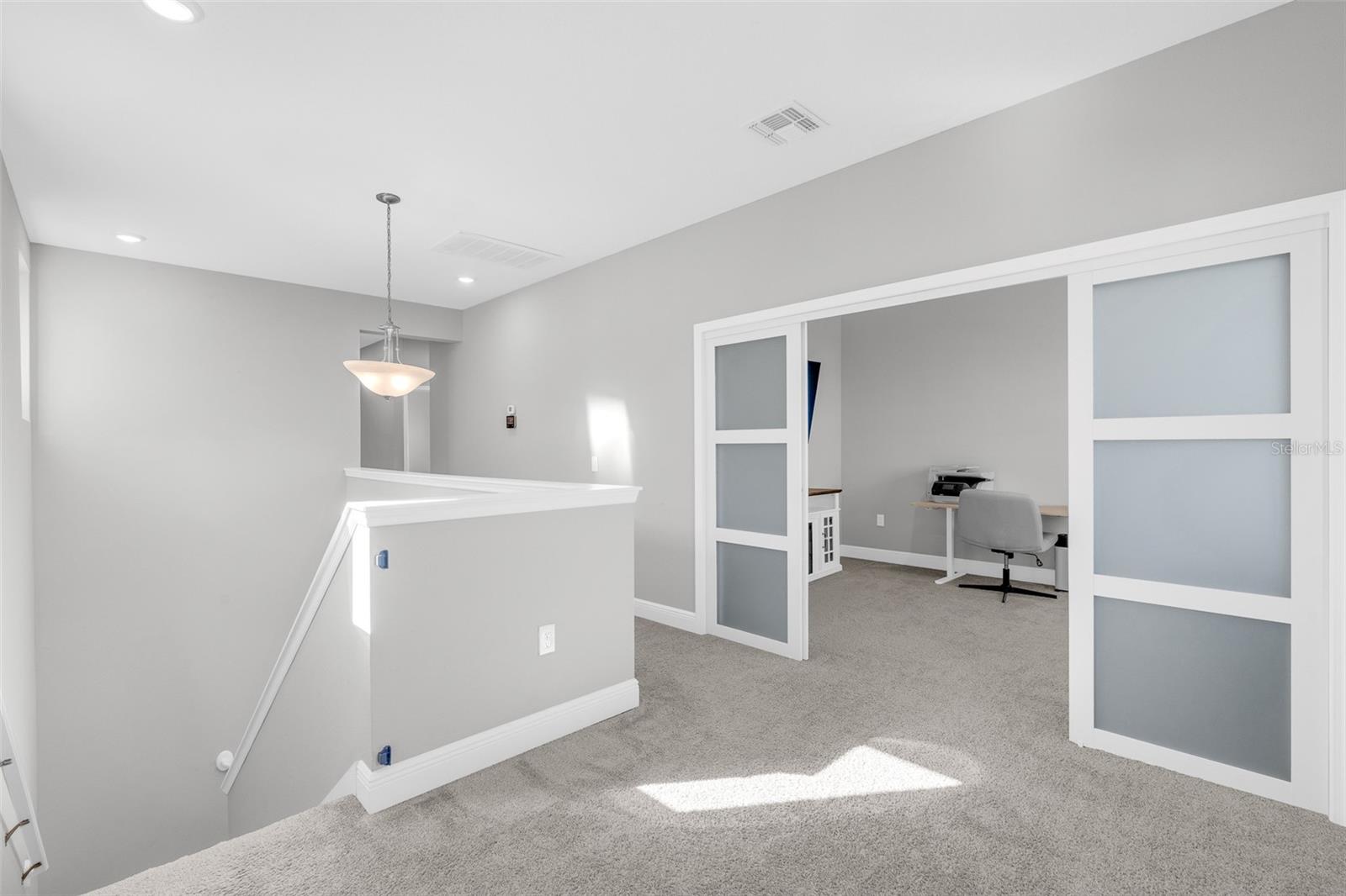 Upstairs loft offering flexible living space