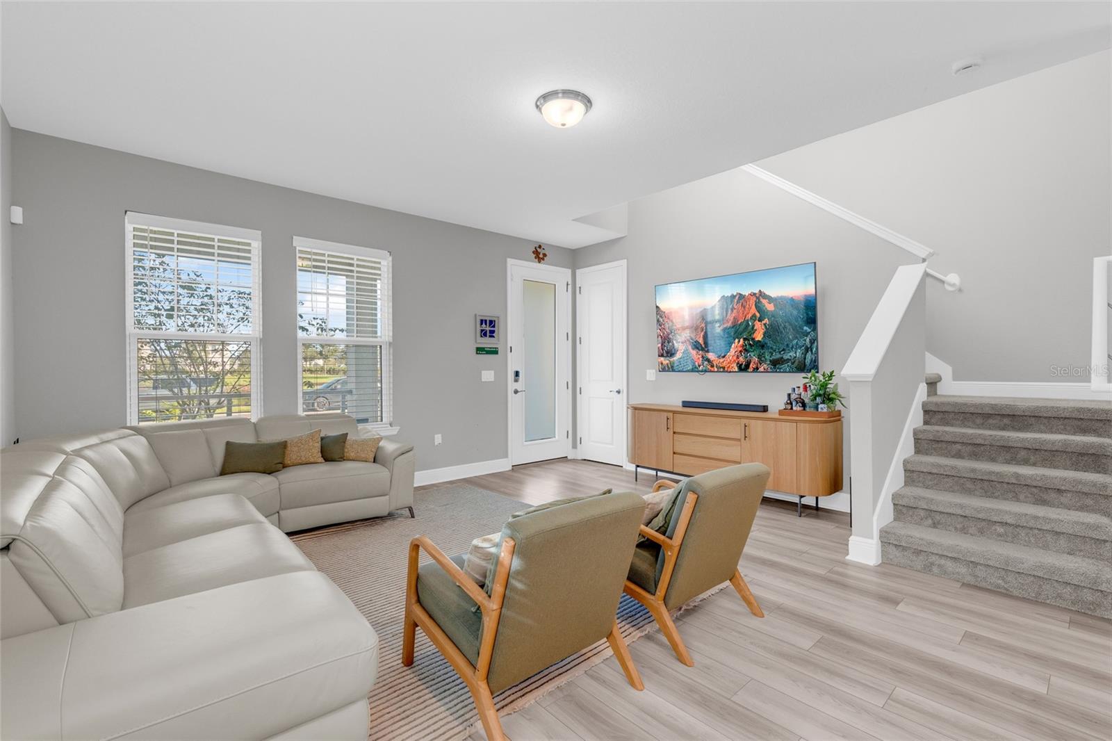Open living area with staircase to the second floor