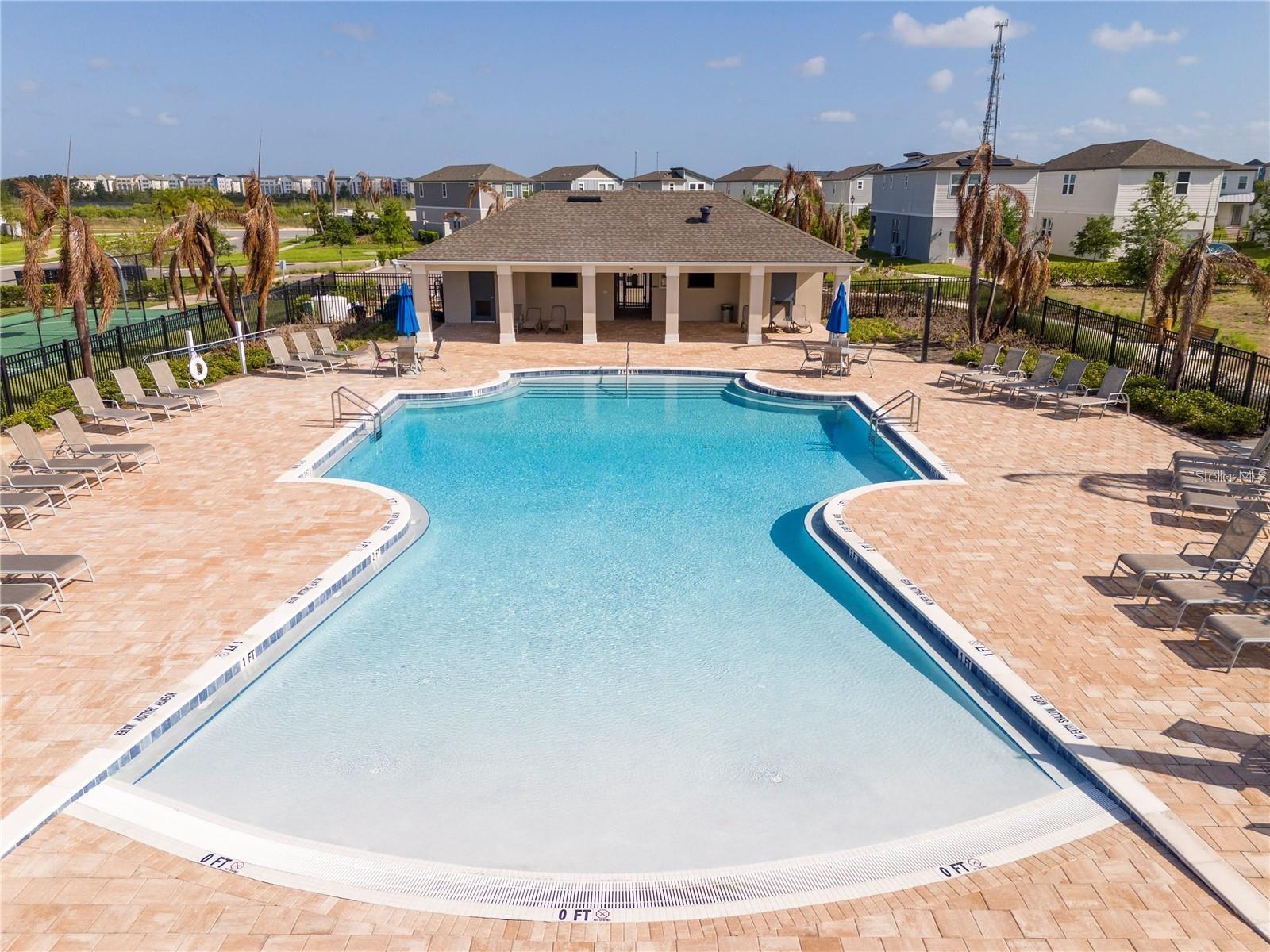 Community pool with spacious sun deck