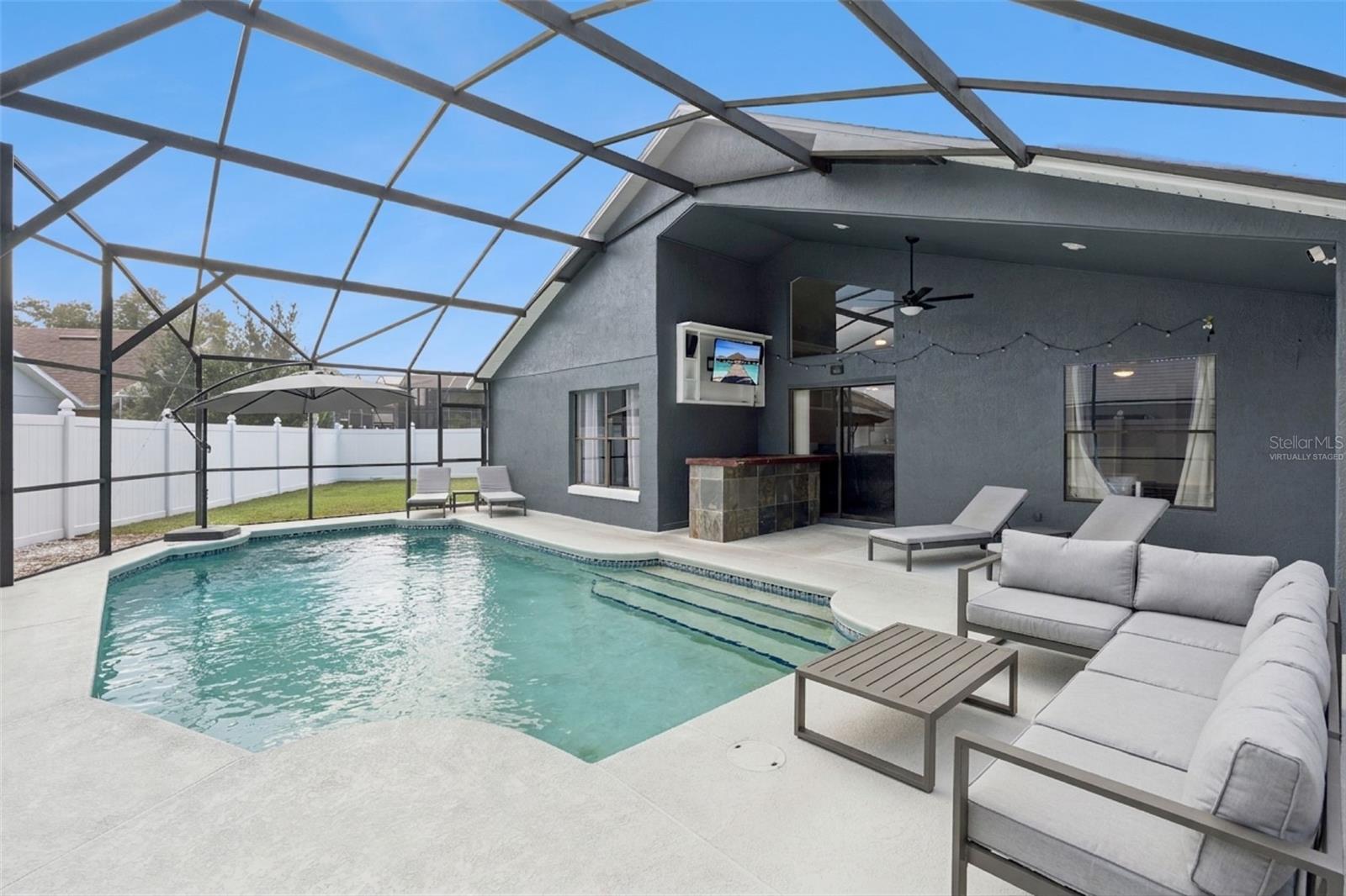 *Virtually staged* spacious lanai and screened in pool