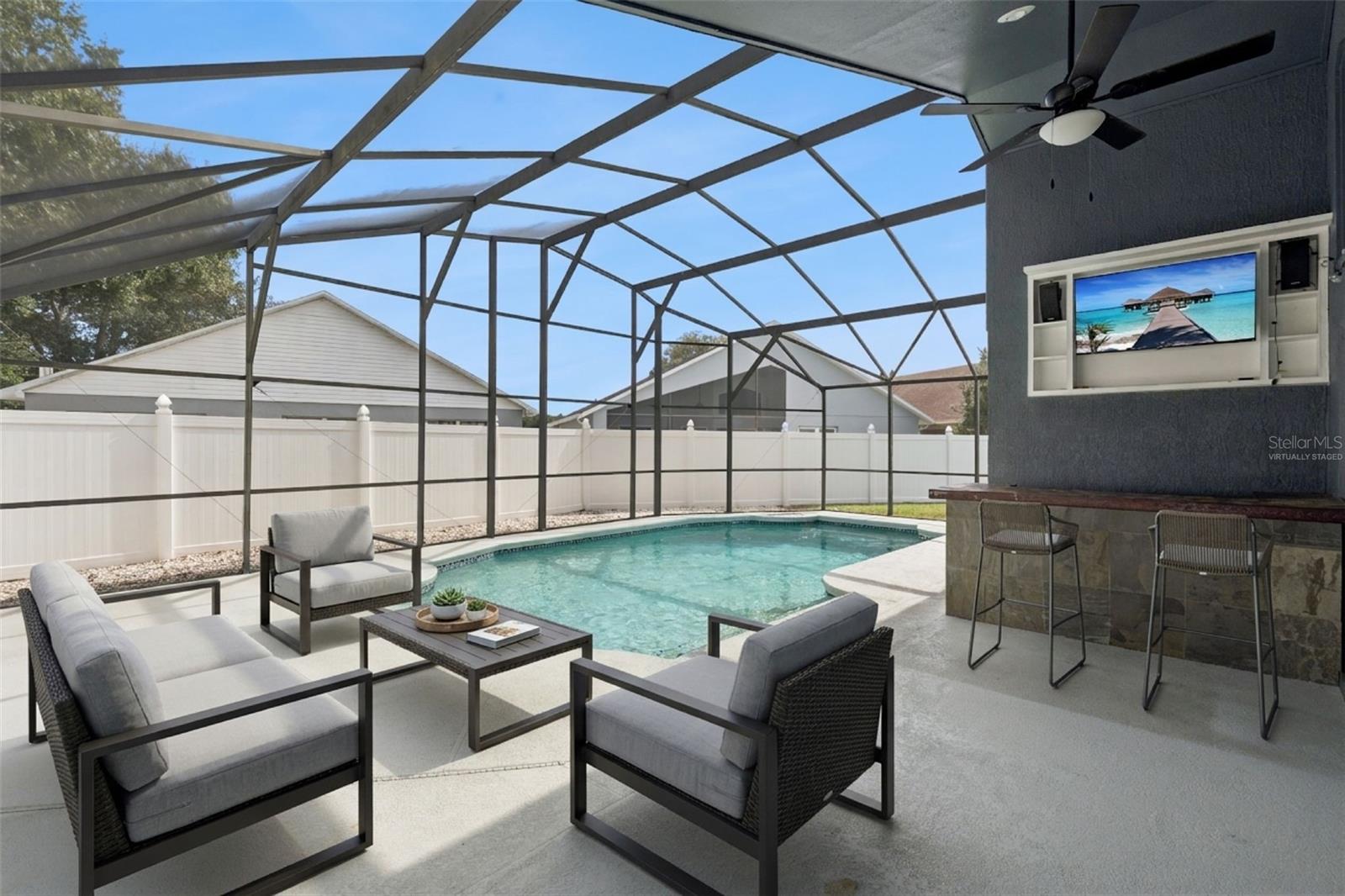 *Virtually staged* Lanai and pool with a built in bar