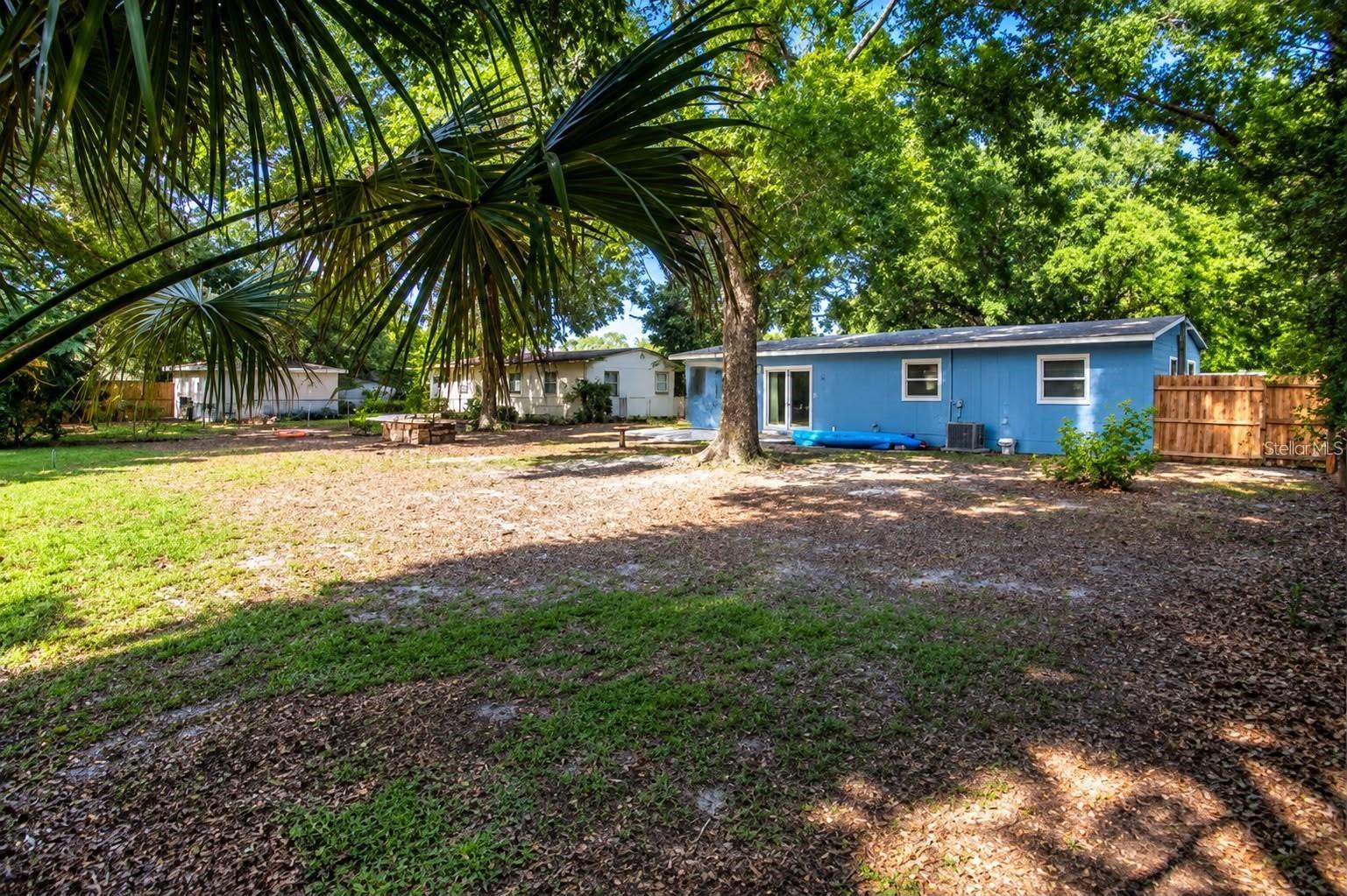 Enjoy your own backyard retreat with lush greenery, natural shade, and outdoor space to make your own.