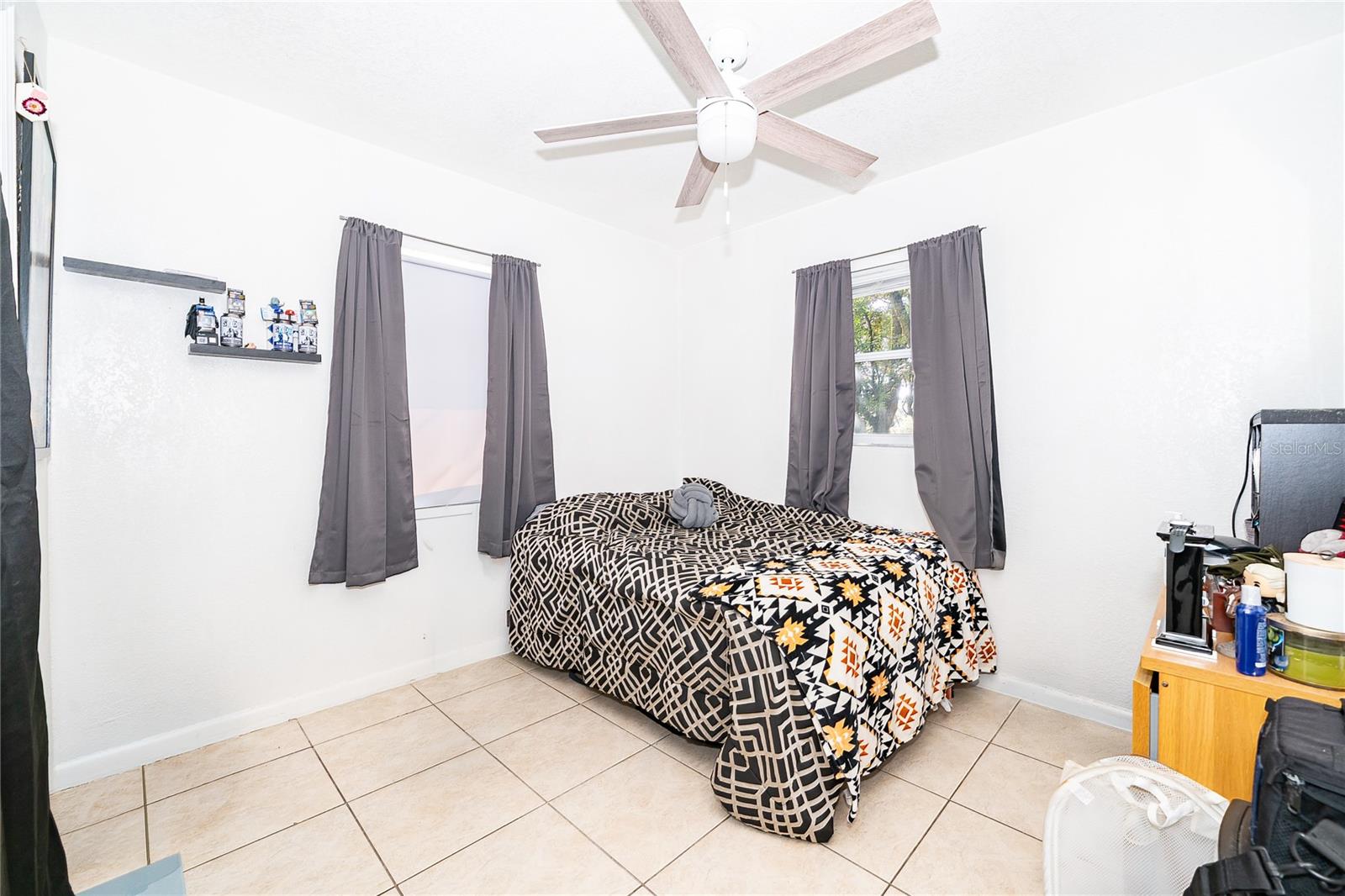 A comfortable bedroom filled with natural light, offering a relaxing space to unwind and recharge.