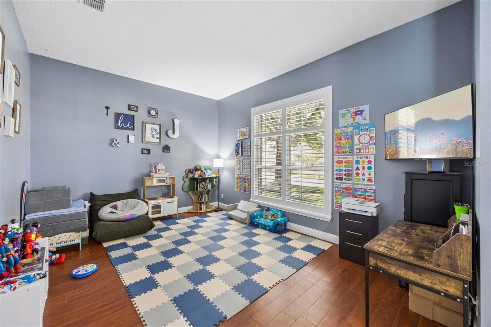 1505 Grassy Ridge Ln -front living space currently used as a playroom