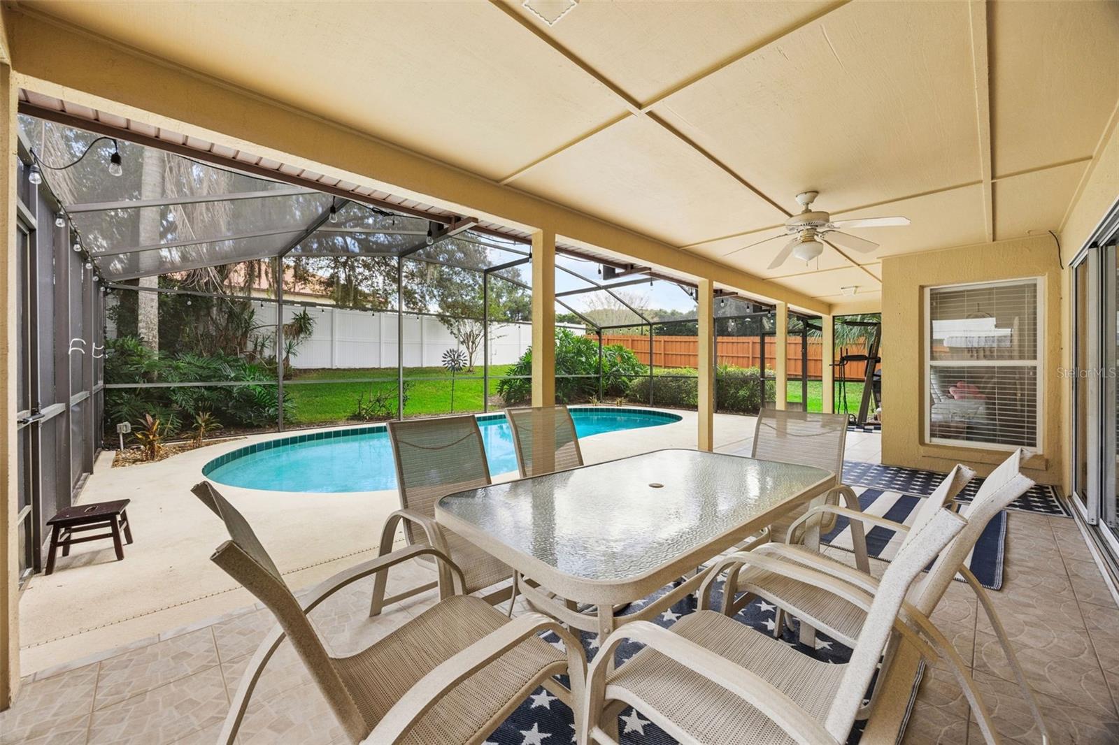 1505 Grassy Ridge Ln - covered outdoor dining overlooking the pool