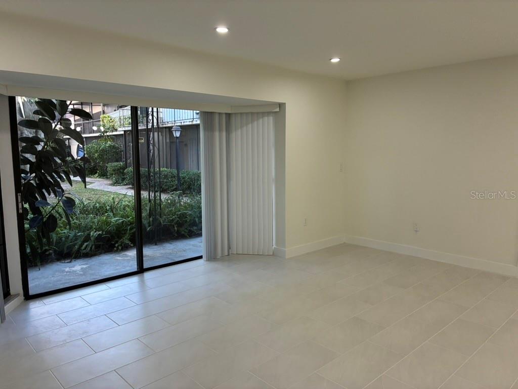 Living room and view of rear porch