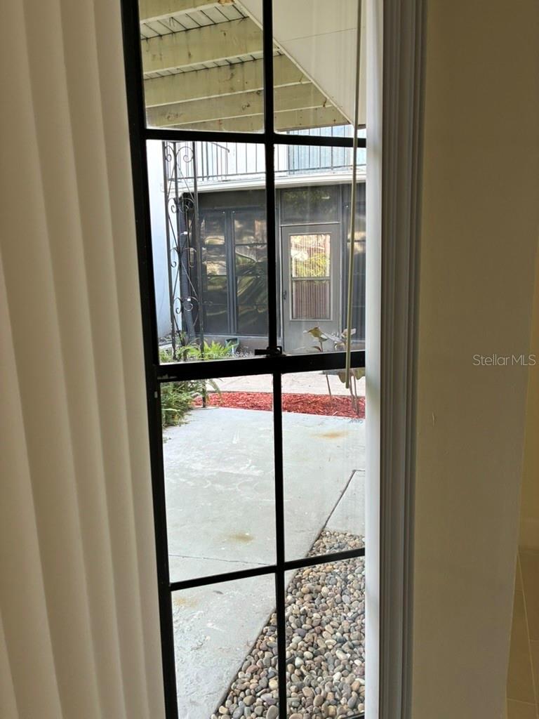 Side window overlooking Bedroom 2 patio