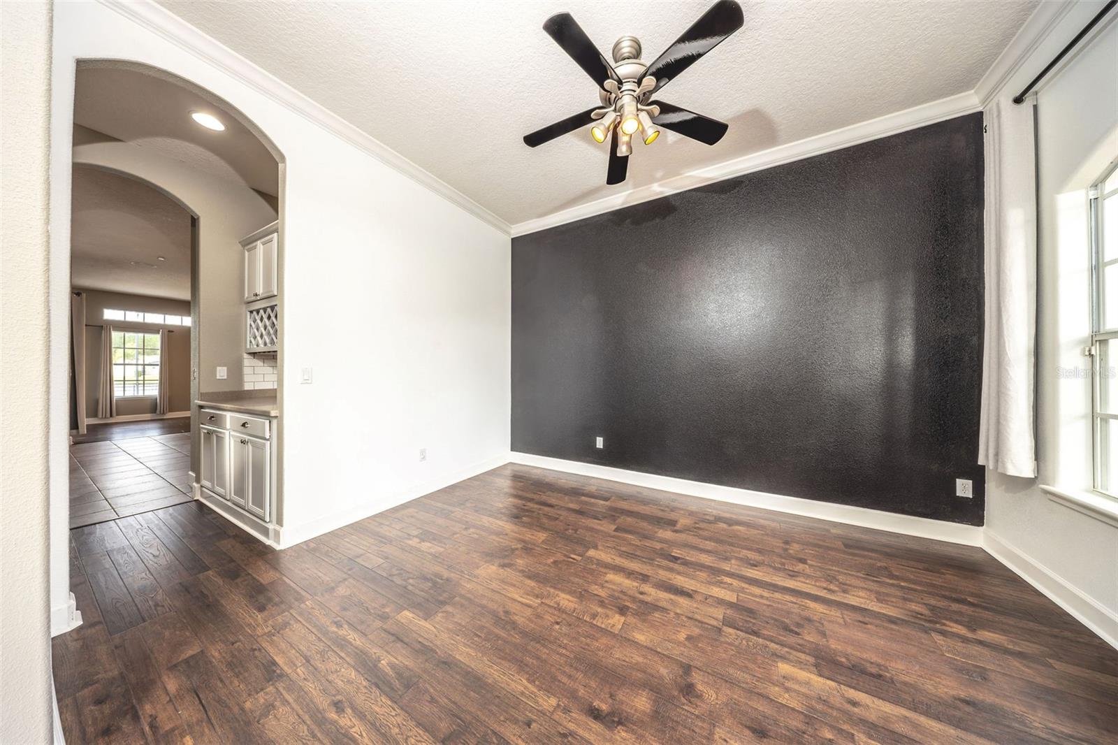 Formal dining leading to butlers pantry and kitchen