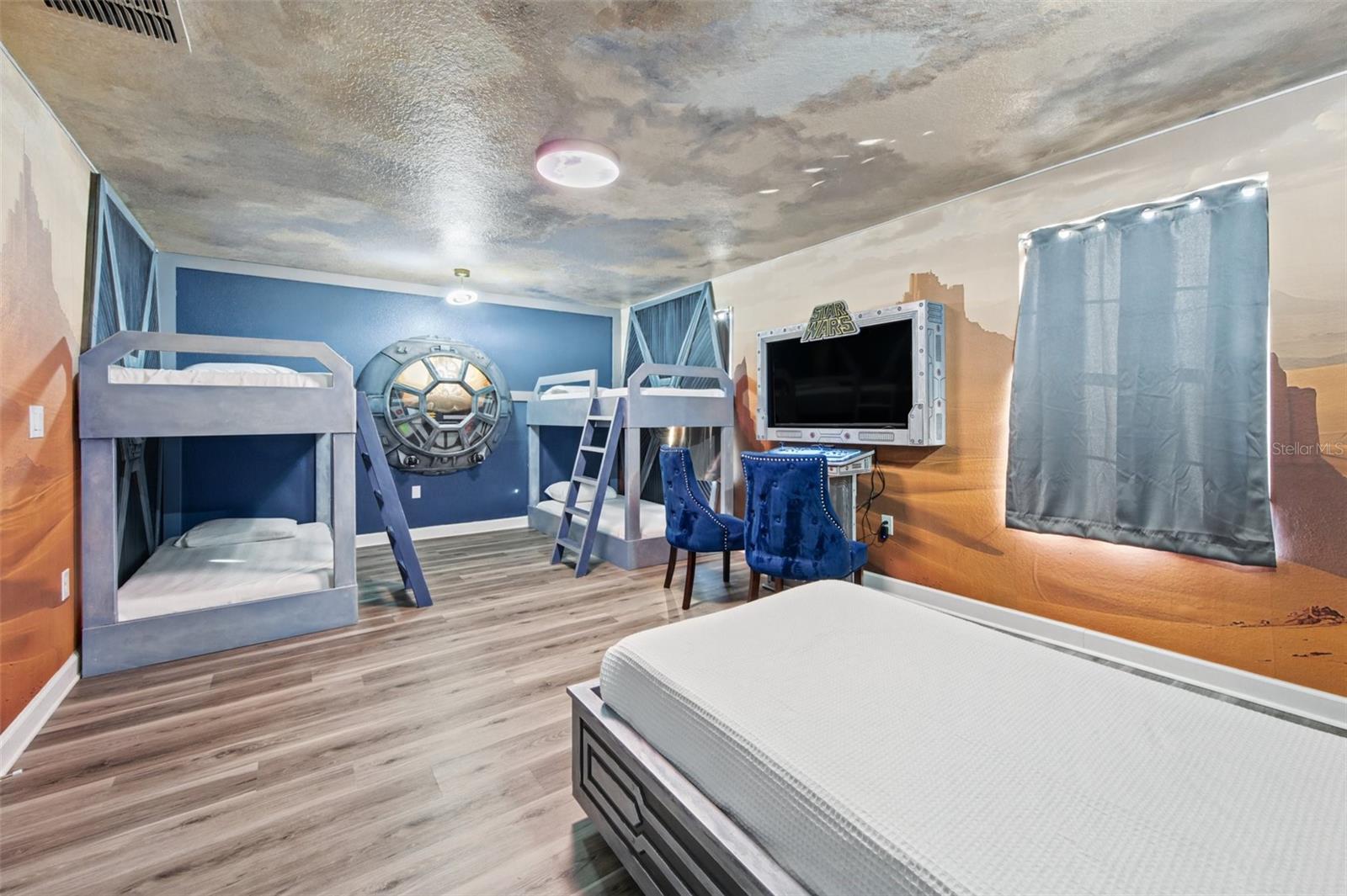 Space-themed bedroom with bunks