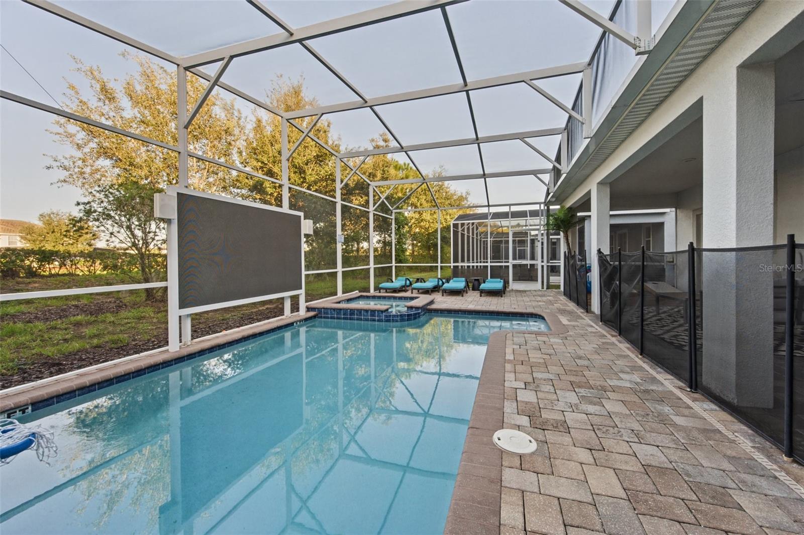 Screened pool with outdoor TV