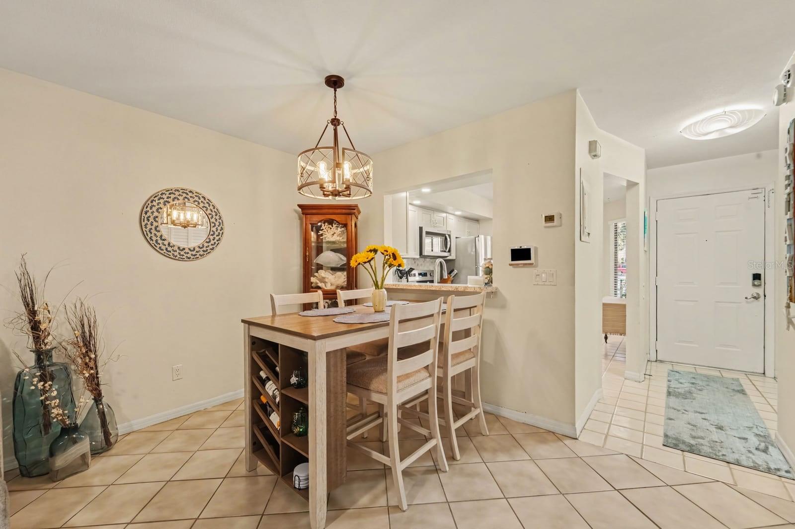 Open Dining Space Flows to Kitchen with Granite Counters Open Dining Space Flows to Kitchen with Granite Counters
