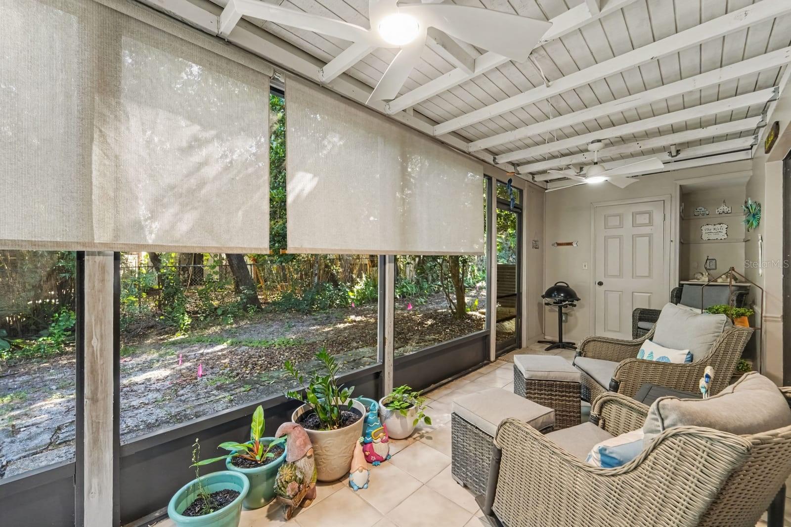 Extended Screened Room with Comfortable Seating and Sunlight