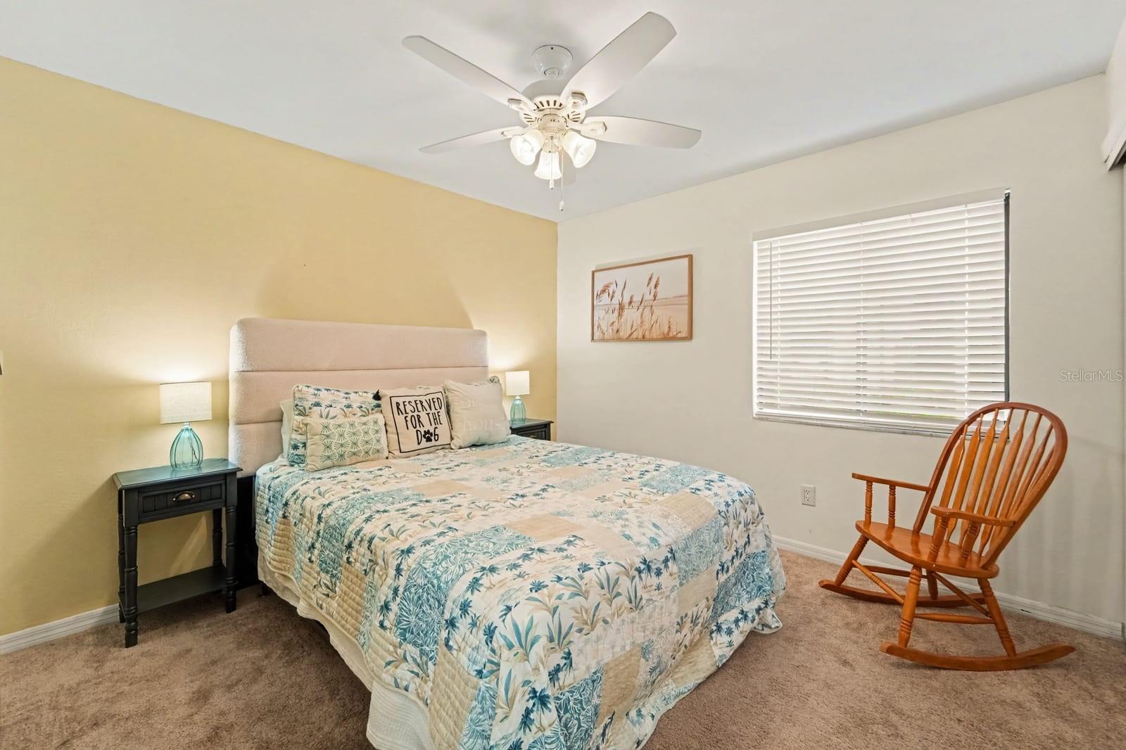 Spacious Master Bedroom with Warm Accents and Natural Light