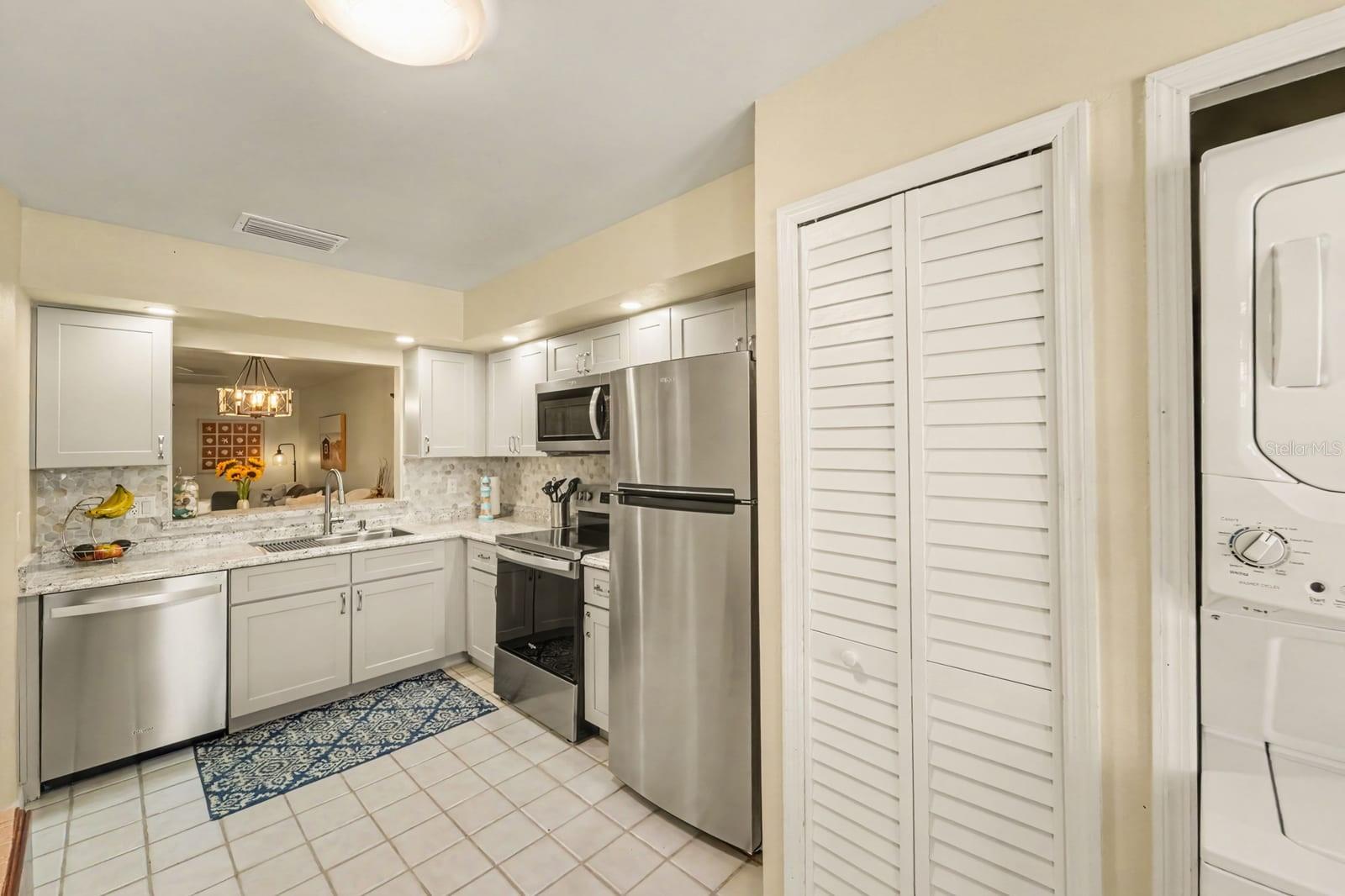 Bright Kitchen with White Cabinetry and Granite Countertops