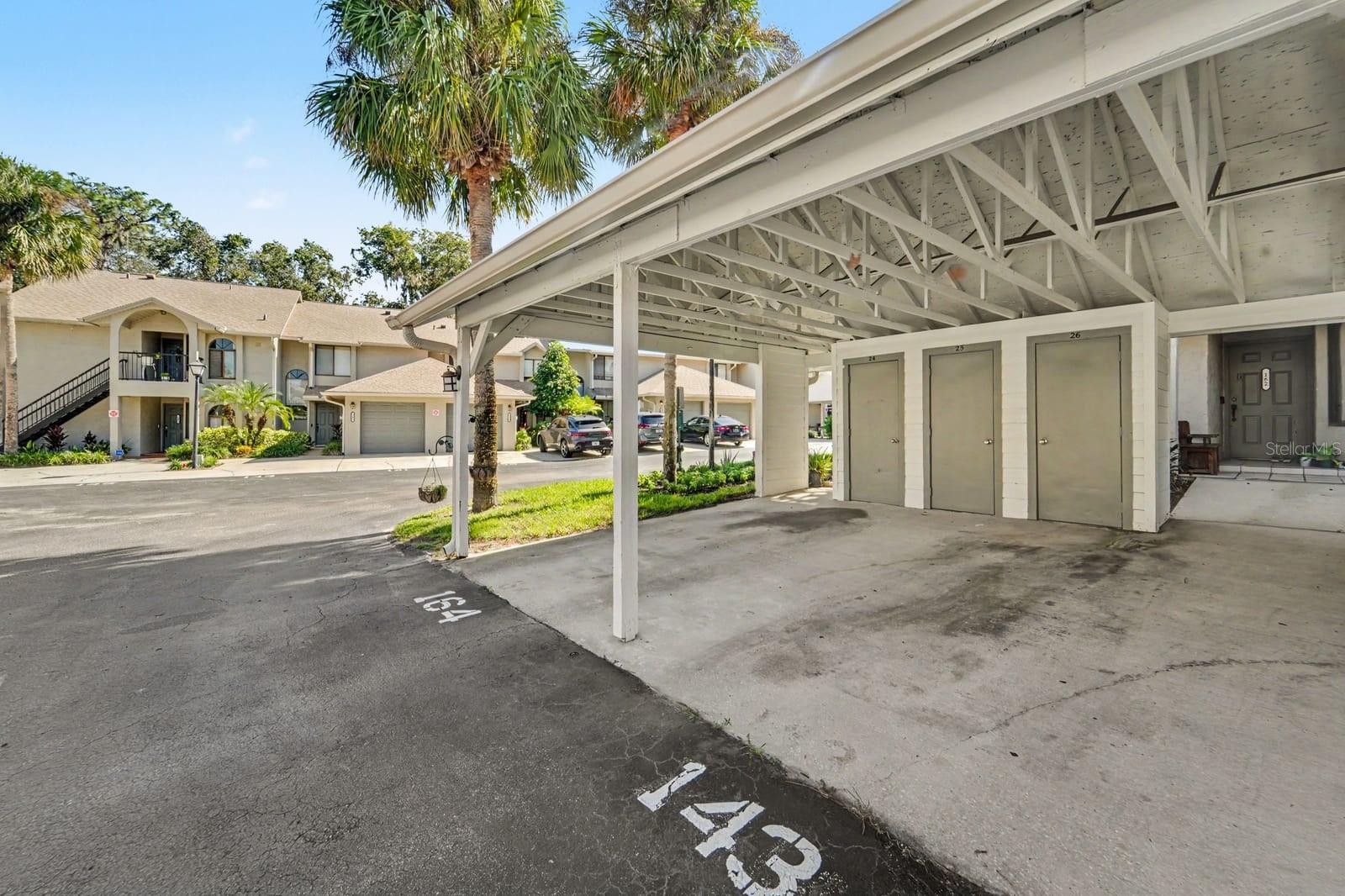 Community Carport Parking With White Posts and Convenient Access