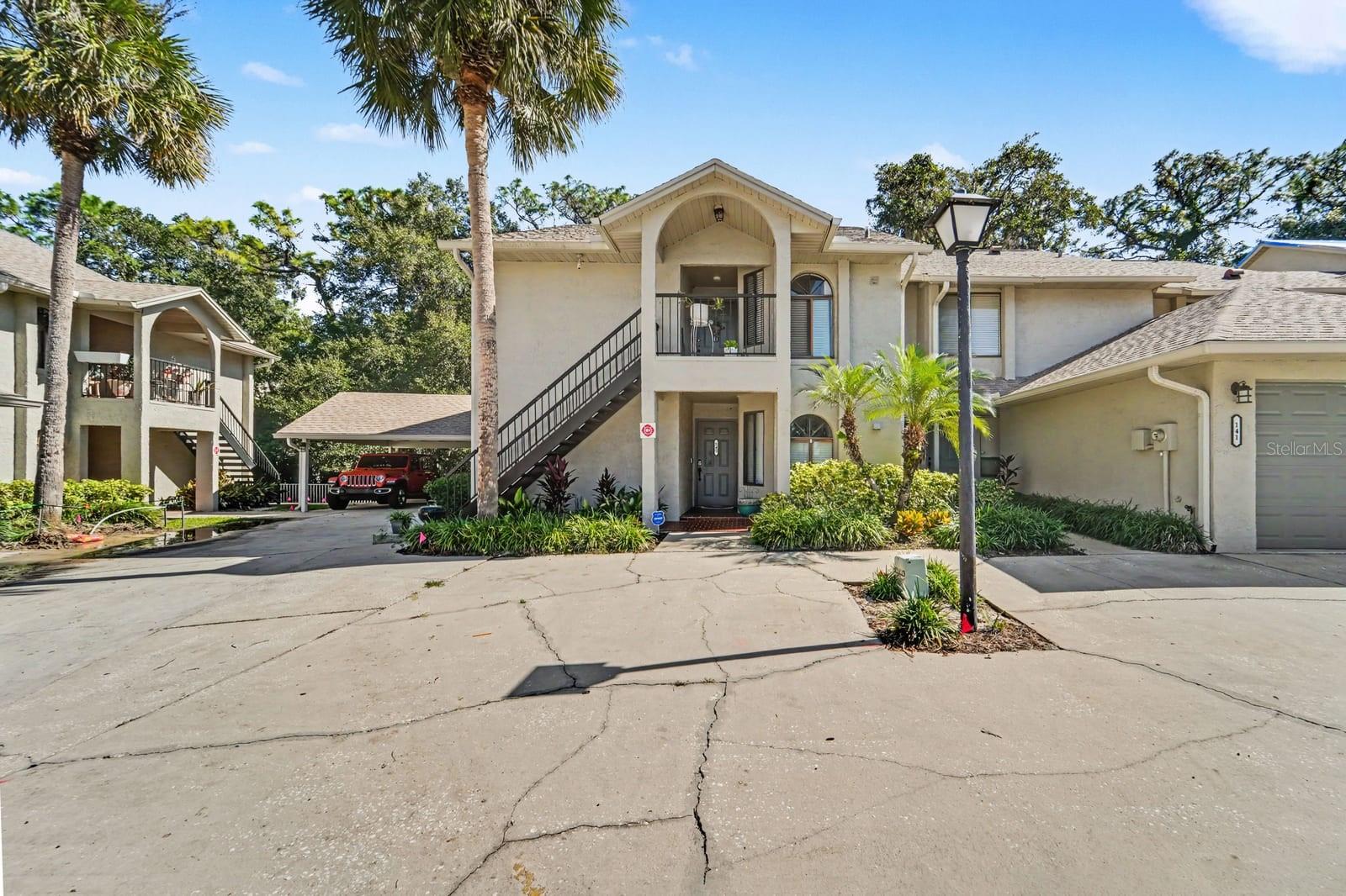 Two-Story Home in Gated Community with Palm Trees and Attached Garage Two-Story Home in Gated Community with Palm Trees and Attached Garage
