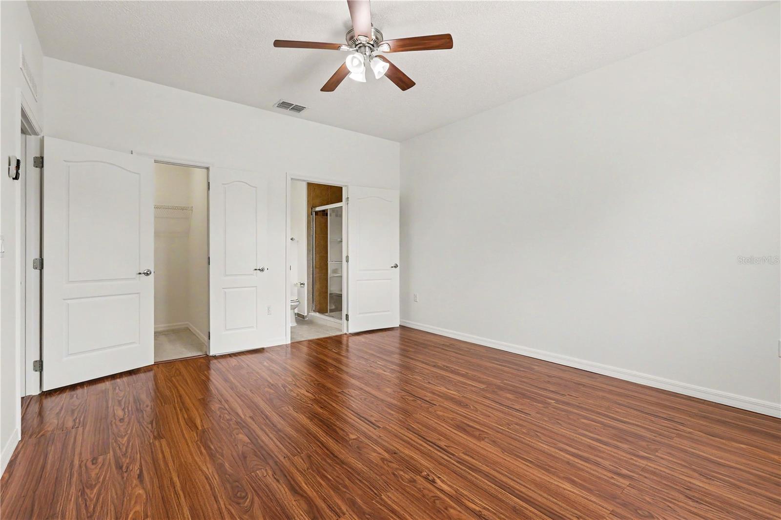 Master Bedroom Suite with vinyl Floors and Ample Closet Space on main floor Master Bedroom Suite with vinyl Floors and Ample Closet Space on main floor