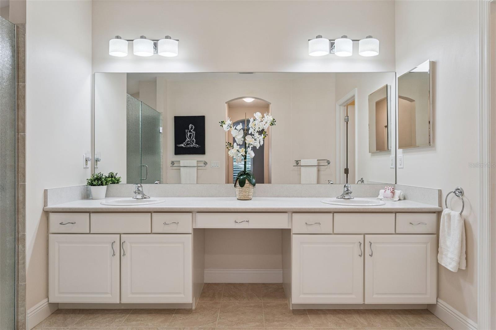 14'6" x 7'6" Primary Bathroom w/ dual sinks & a large glass enclosed walk-in shower