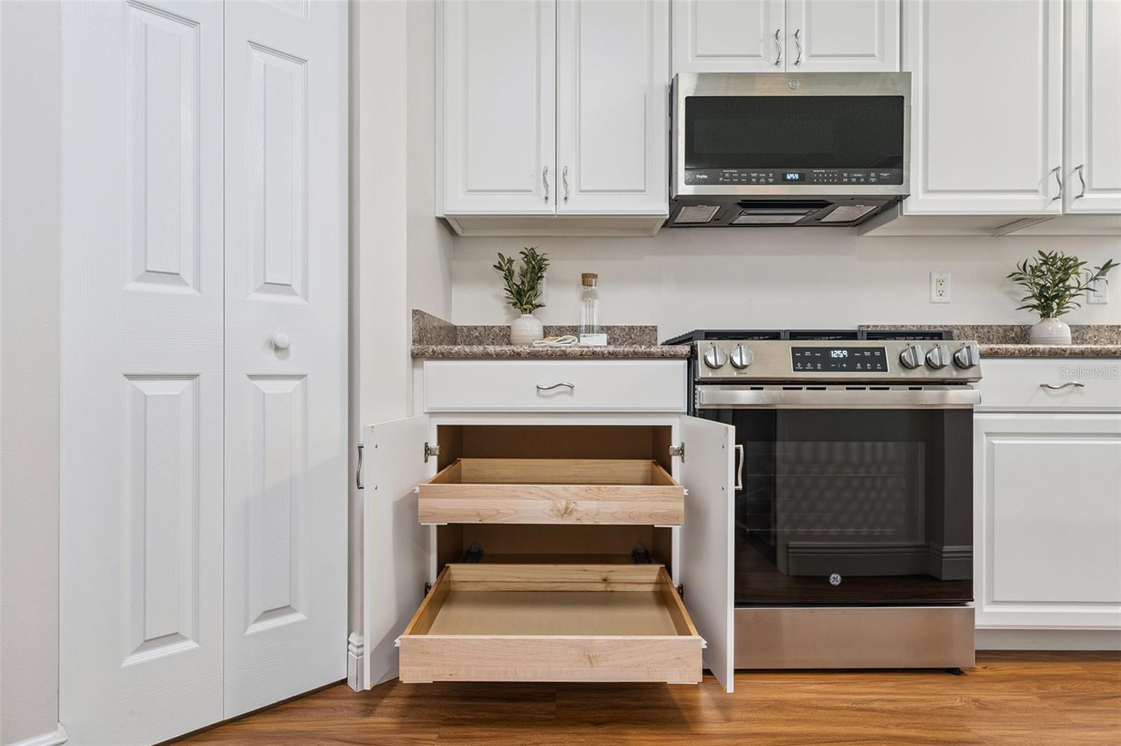 Kitchen cabinets has Pull-out shelving & 2 closet pantry's