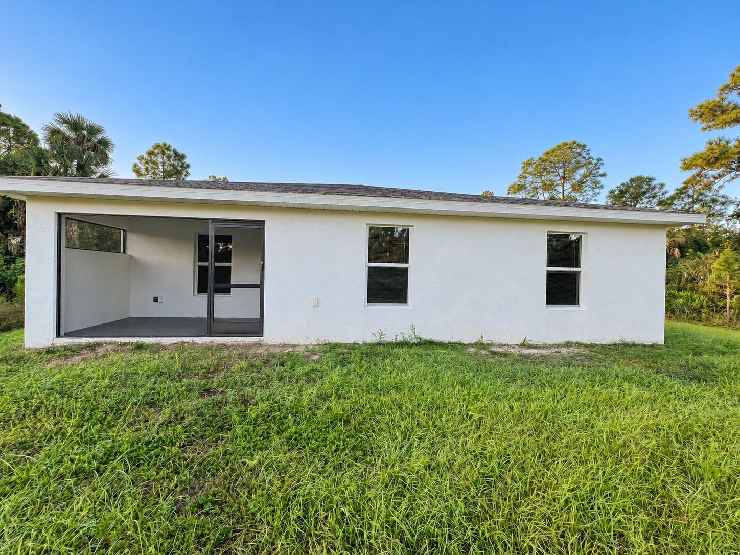 Rear exterior  digitally enhanced; original patio paint color retained.