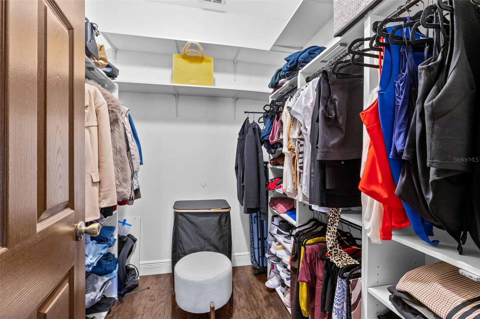 Primary bedroom walk-in closet