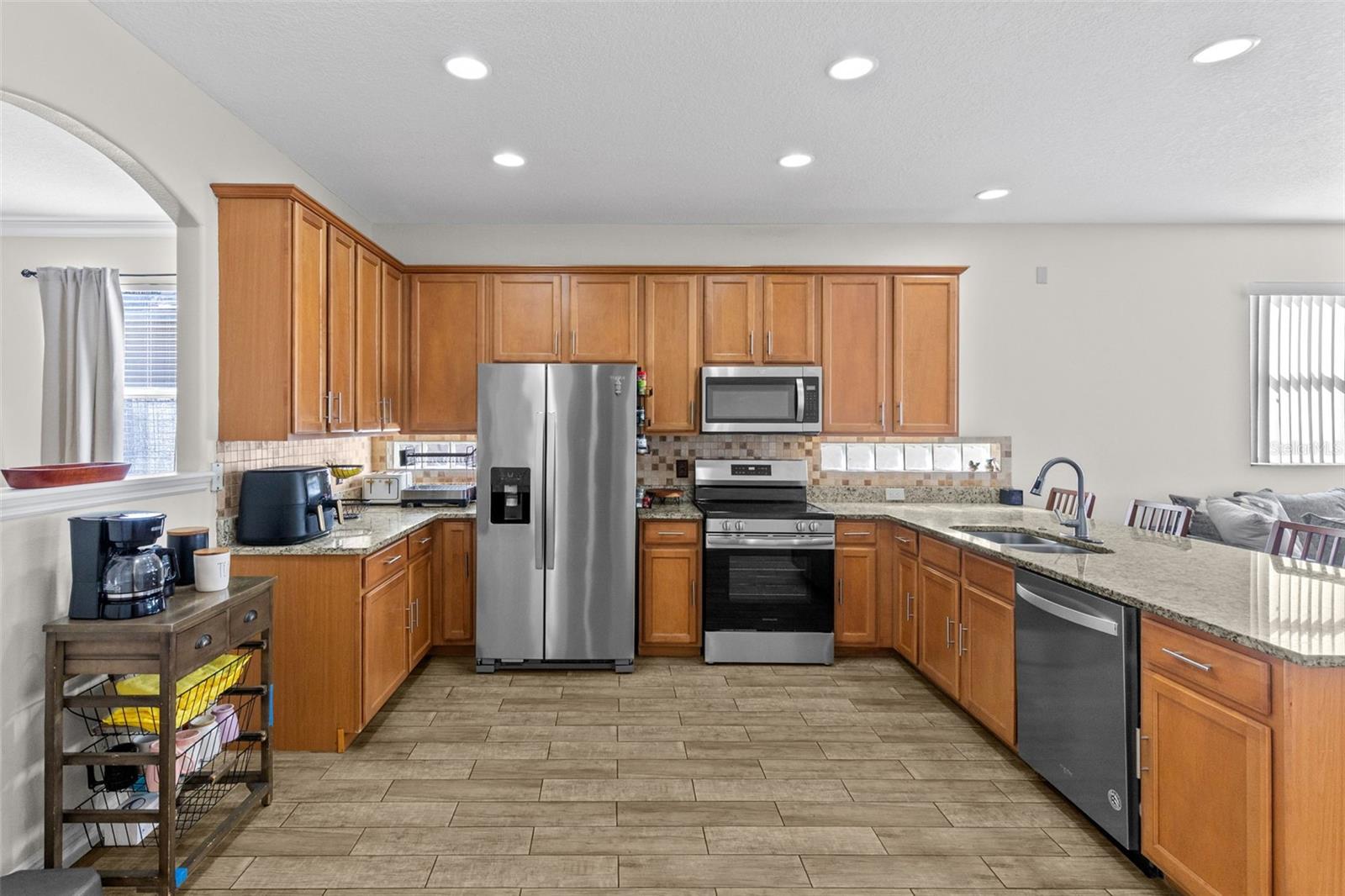 Kitchen with granite countertops, stainless steel appliances and 42 cabinets